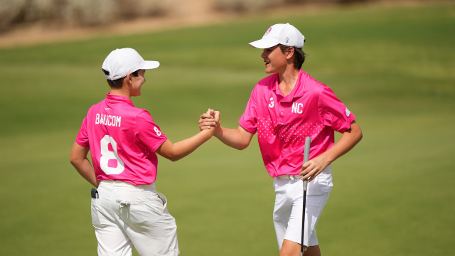 Graden Lomax reacts with Grayson Baucom of Team North Carolina after scoring a birdie on the 15th hole during the second round of the 2022 National Car Rental PGA Jr. League Championship at Grayhawk Golf Club on October 8, 2022 in Scottsdale, Arizona. (Photo by Darren Carroll/PGA of America)