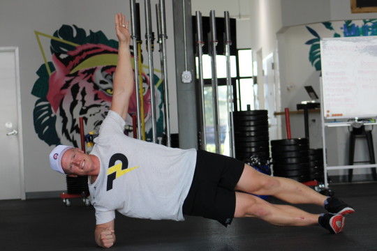 Thor Parrish, PGA, demonstrates a side plank. 