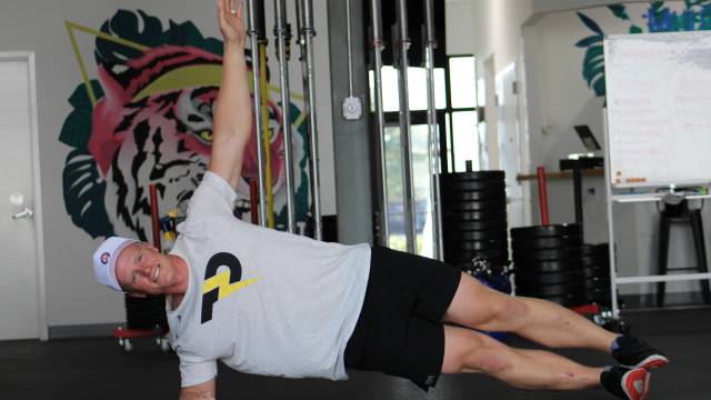 Thor Parrish, PGA, demonstrates a side plank. 