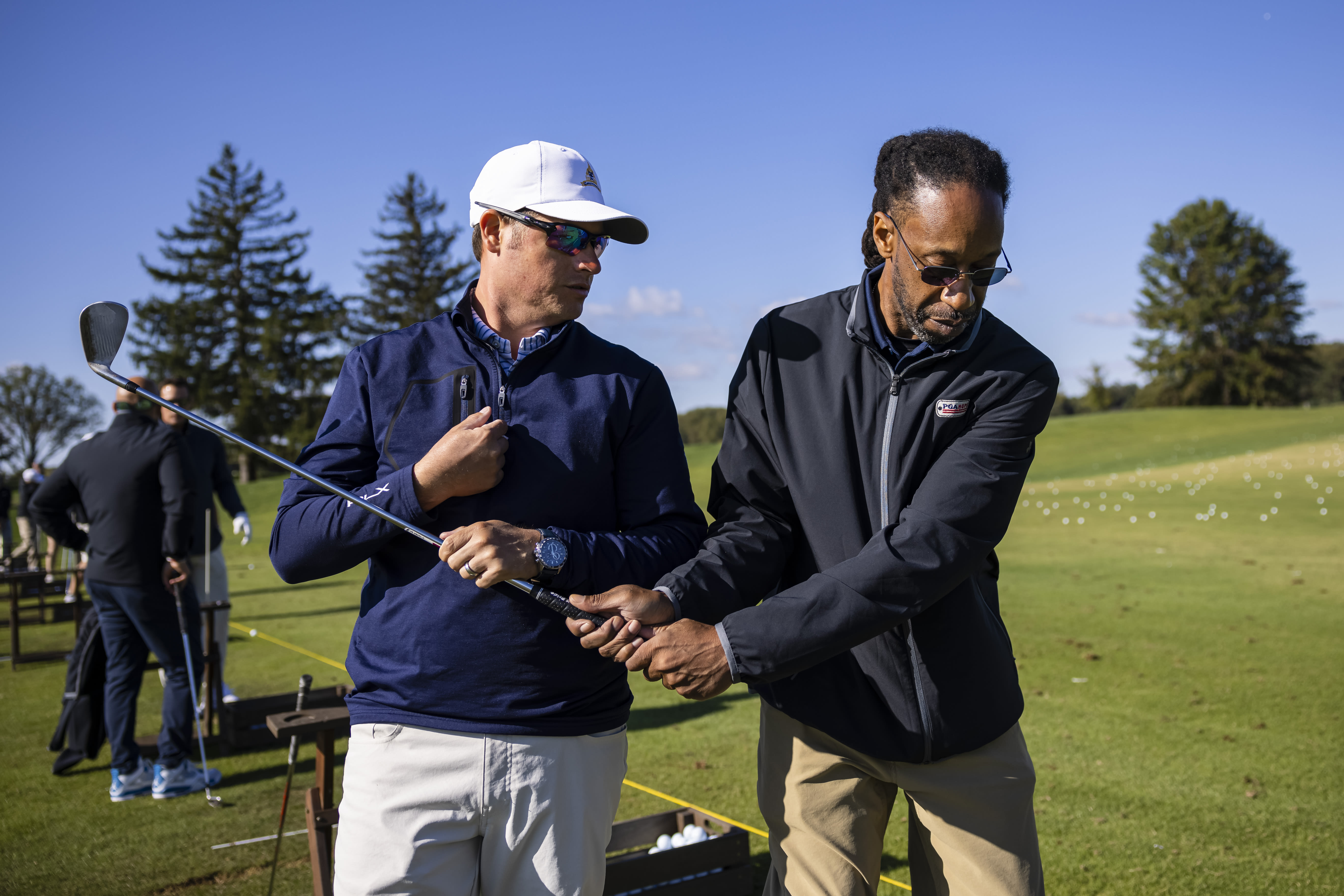 Ralph Mayo Jr. and a PGA HOPE instructor. 