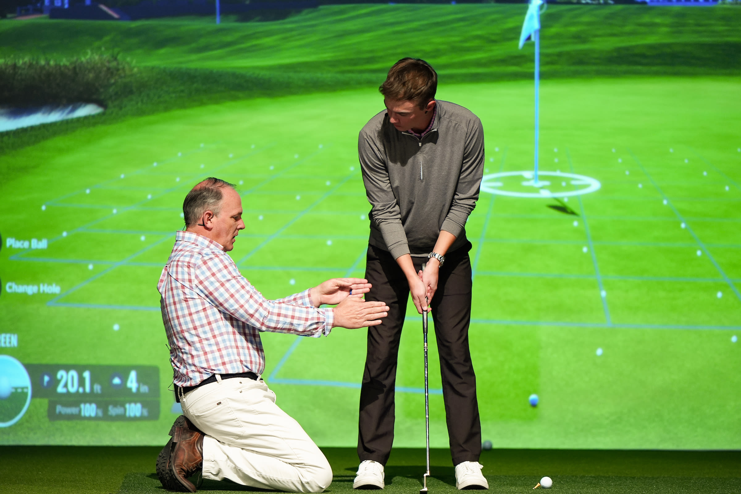 David Orr, PGA, helping out a PGM student with his stroke.