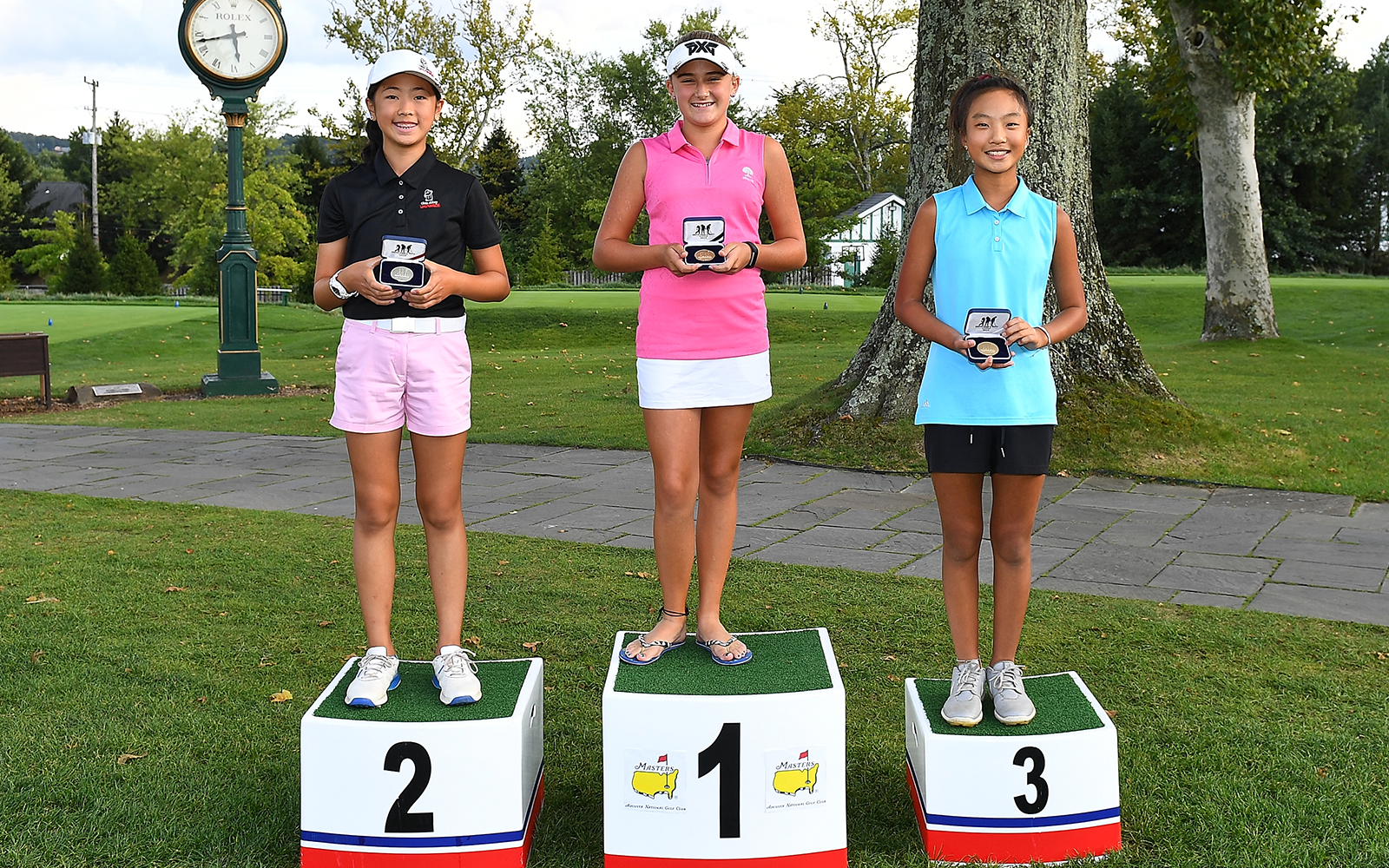 Girls 12-13 age group putt contest top three, second place Angela Cai, first place Gianna Clemente, and third place Amelia Cho, pose with their medals during the regional round of the Drive, Putt, and Chip competition at Oakmont Country Club on September 7, 2019 in Oakmont, Pennsylvania. (Photo by Joe Sargent/Getty Images for the DC&P Championship)