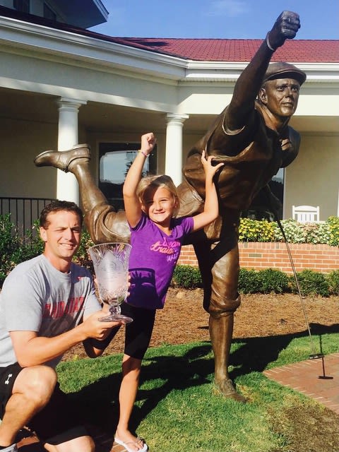 Gianna with her trophy & the Payne Stewart Statue at Pinehurst. 