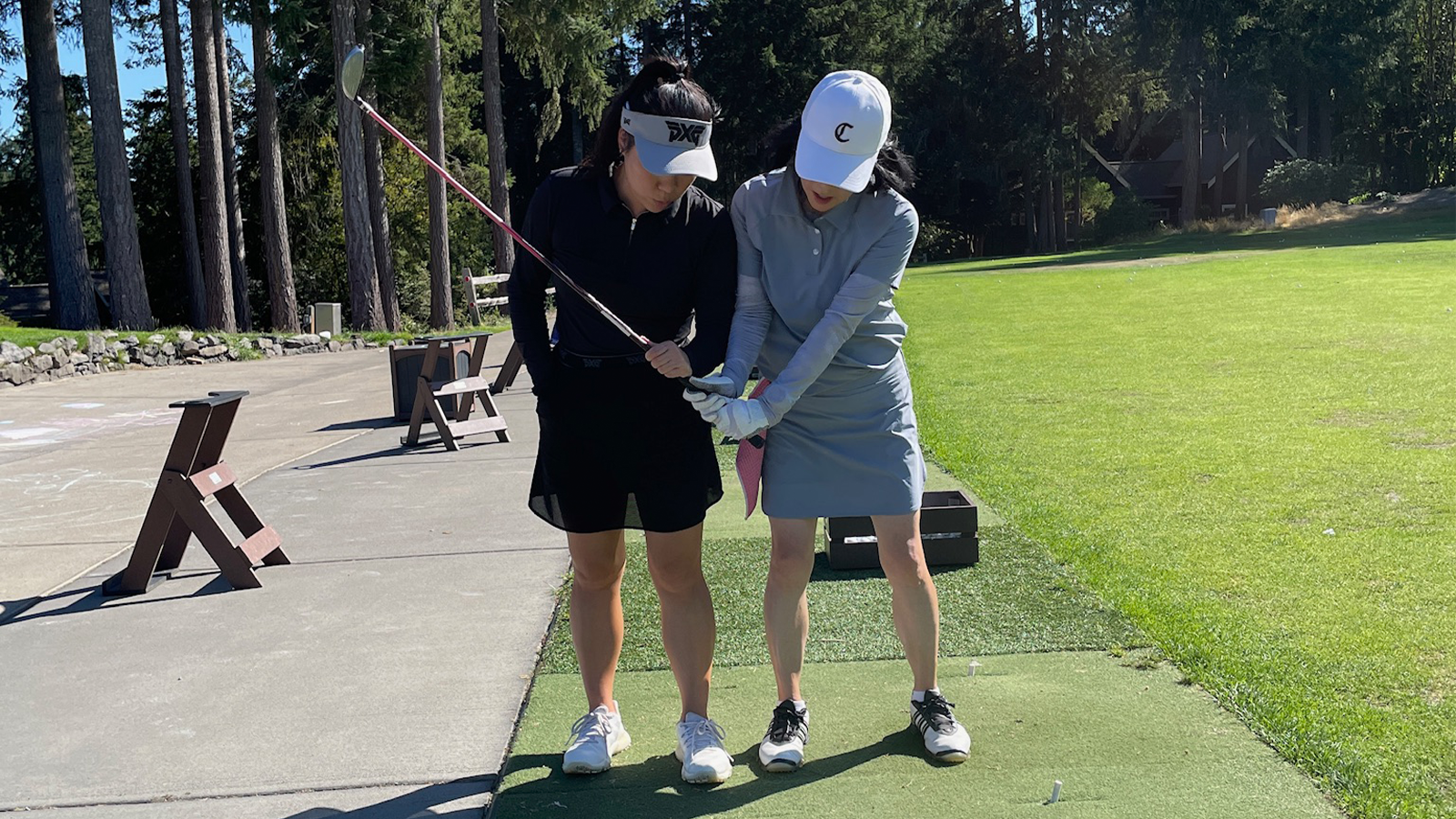 Cathy Kim, PGA, giving a lesson. 