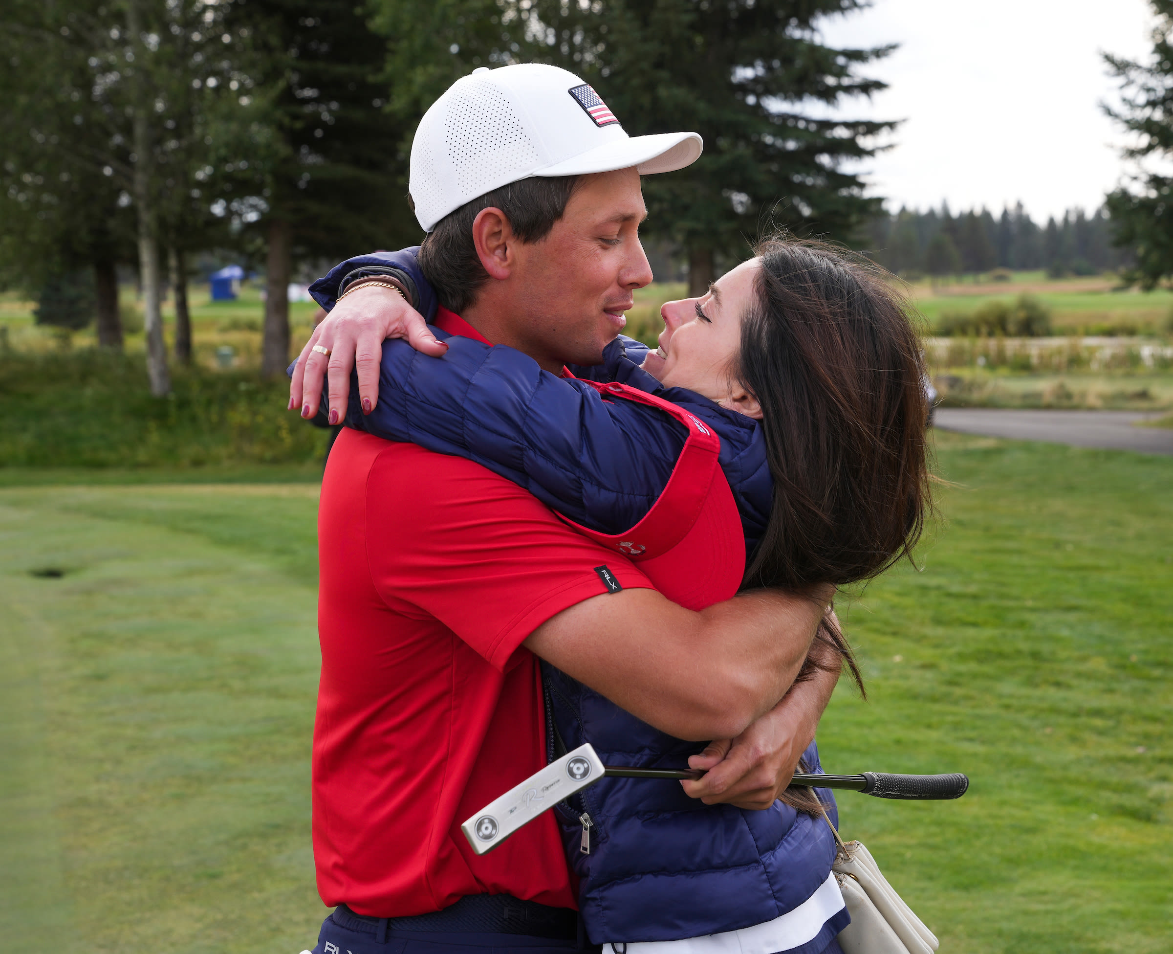  Polland and his fiancee, Aly Mackenzie, celebrate his Singles win.