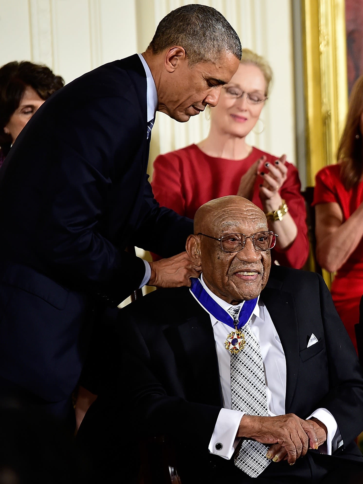 Sifford receiving the Presidential Medal of Freedom from President Obama in 2014.