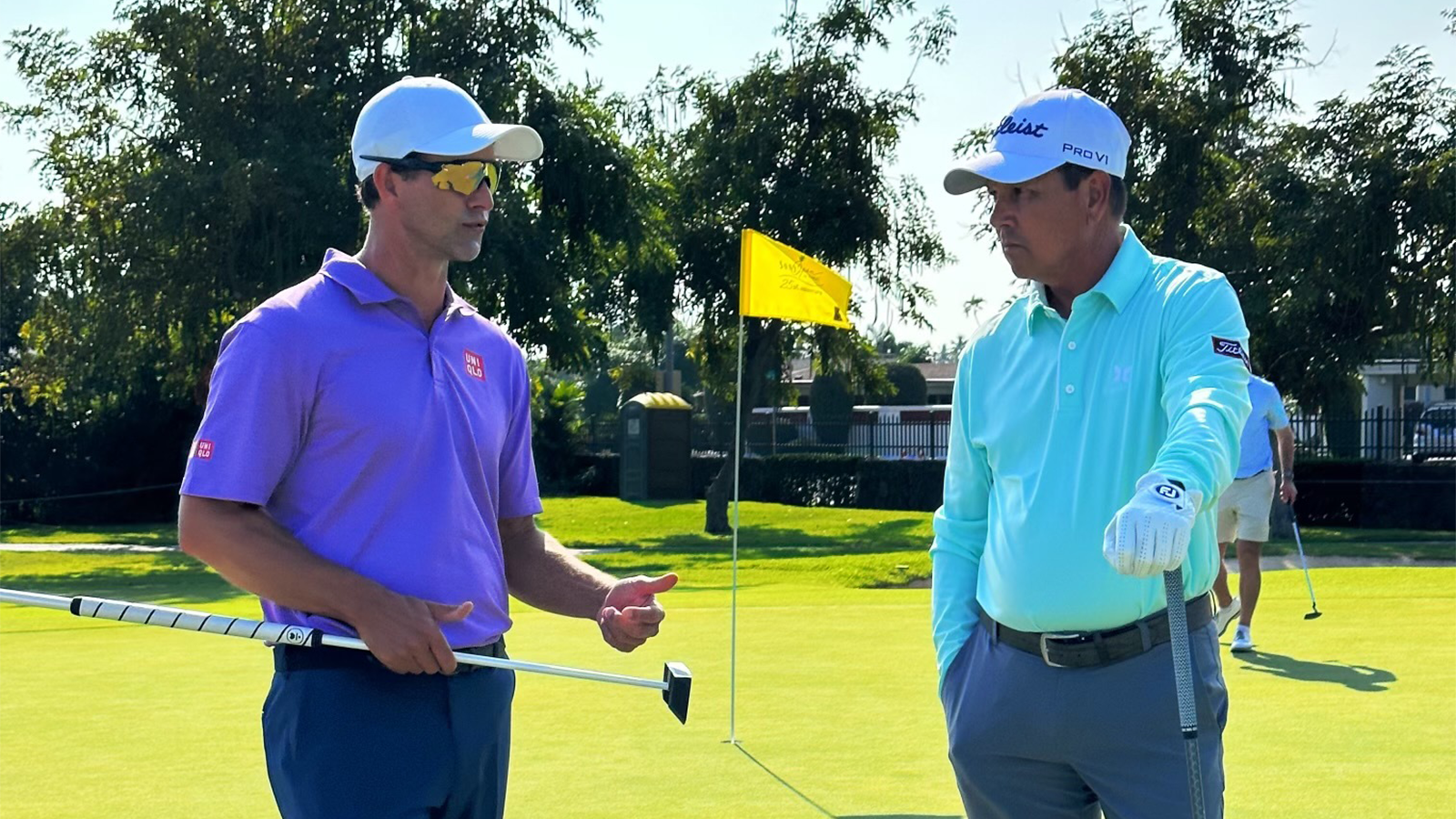 Michael Castillo, PGA, talks with PGA Tour player Adam Scott during a practice round at the 2023 Sony Open. 