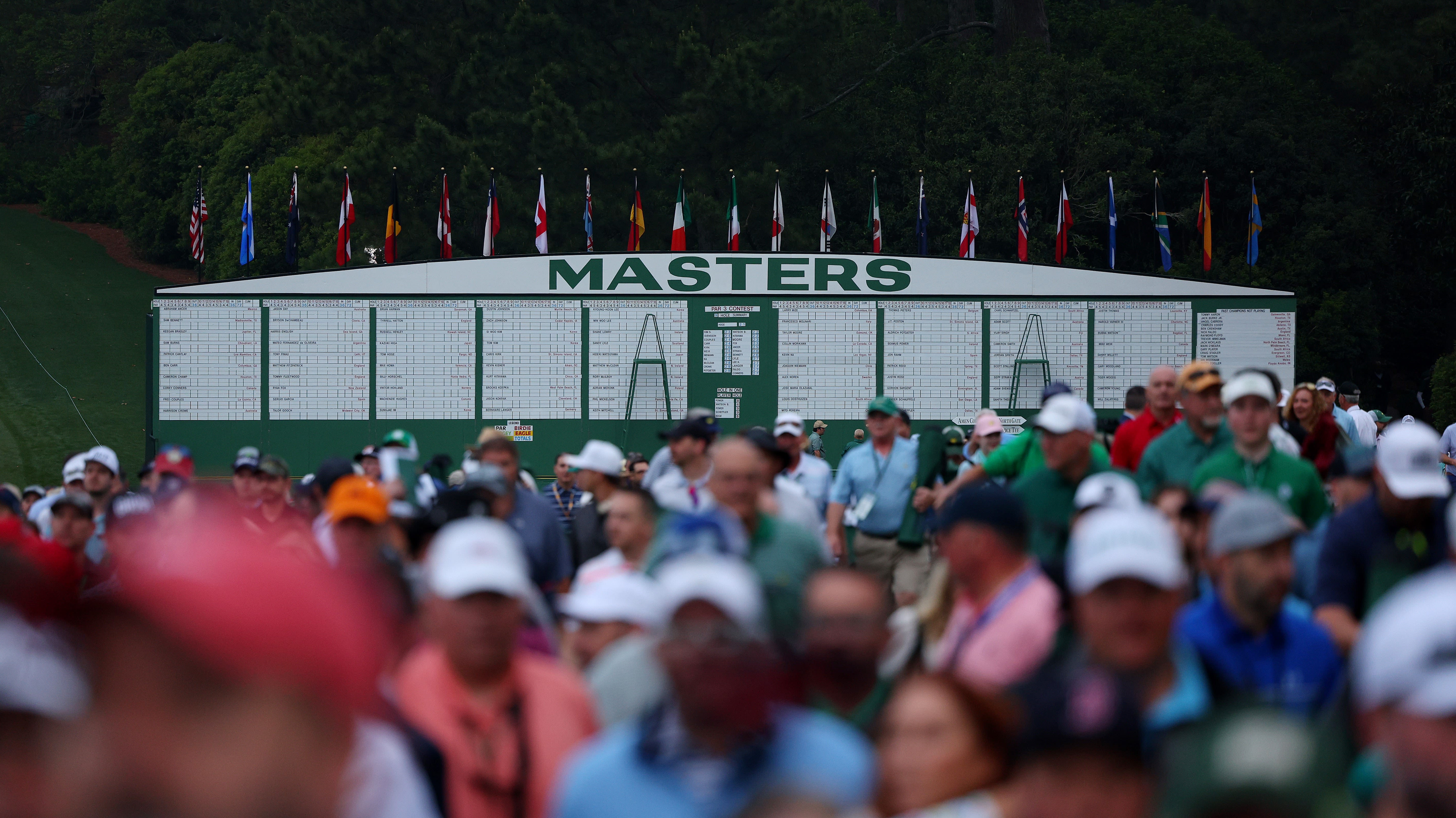 Patrons walk onto the course prior to the the first round of the 2023 Masters Tournament at Augusta National Golf Club. (Photo by Andrew Redington/Getty Images)