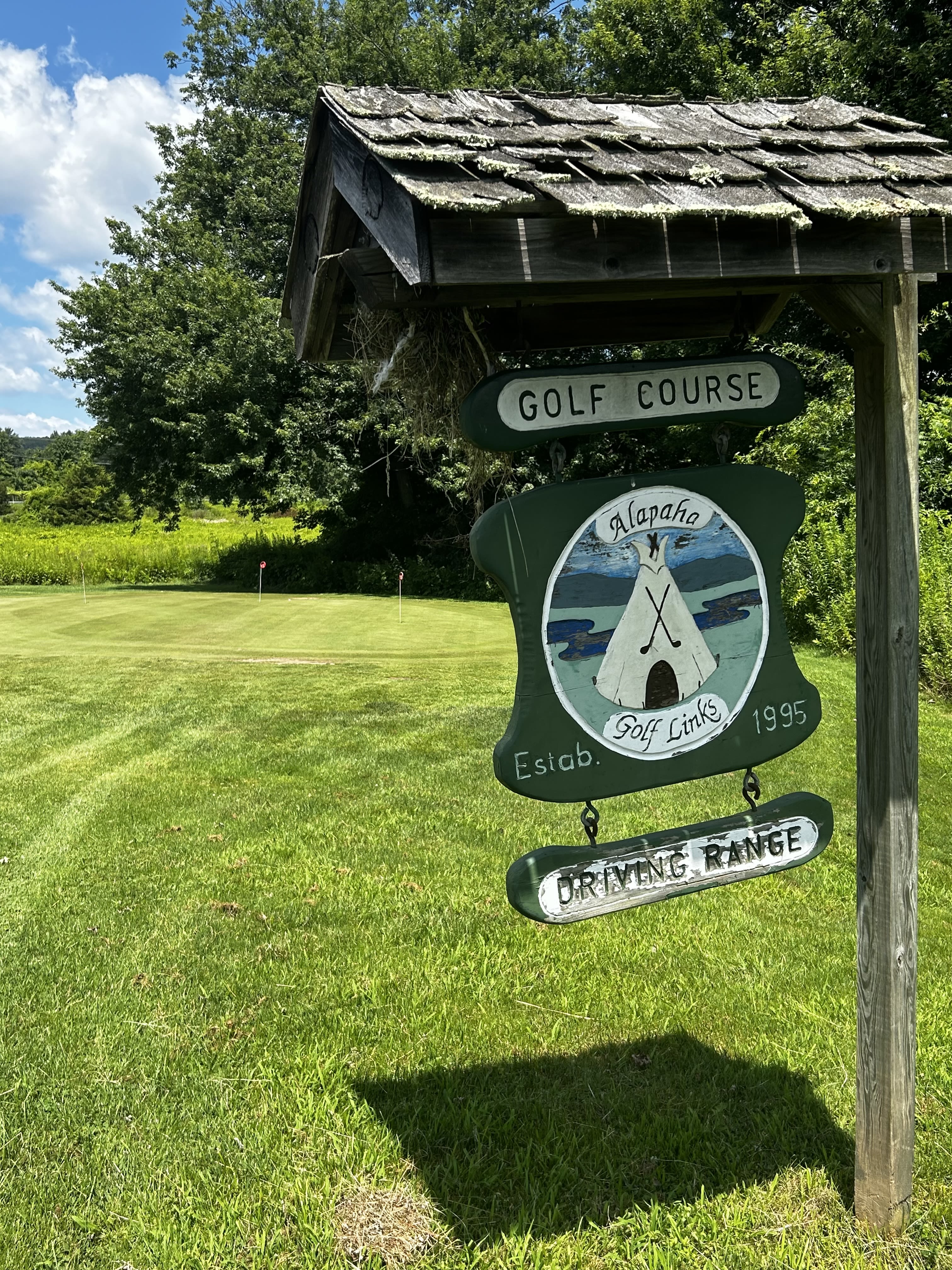 Signage for Alapha Golf Center.