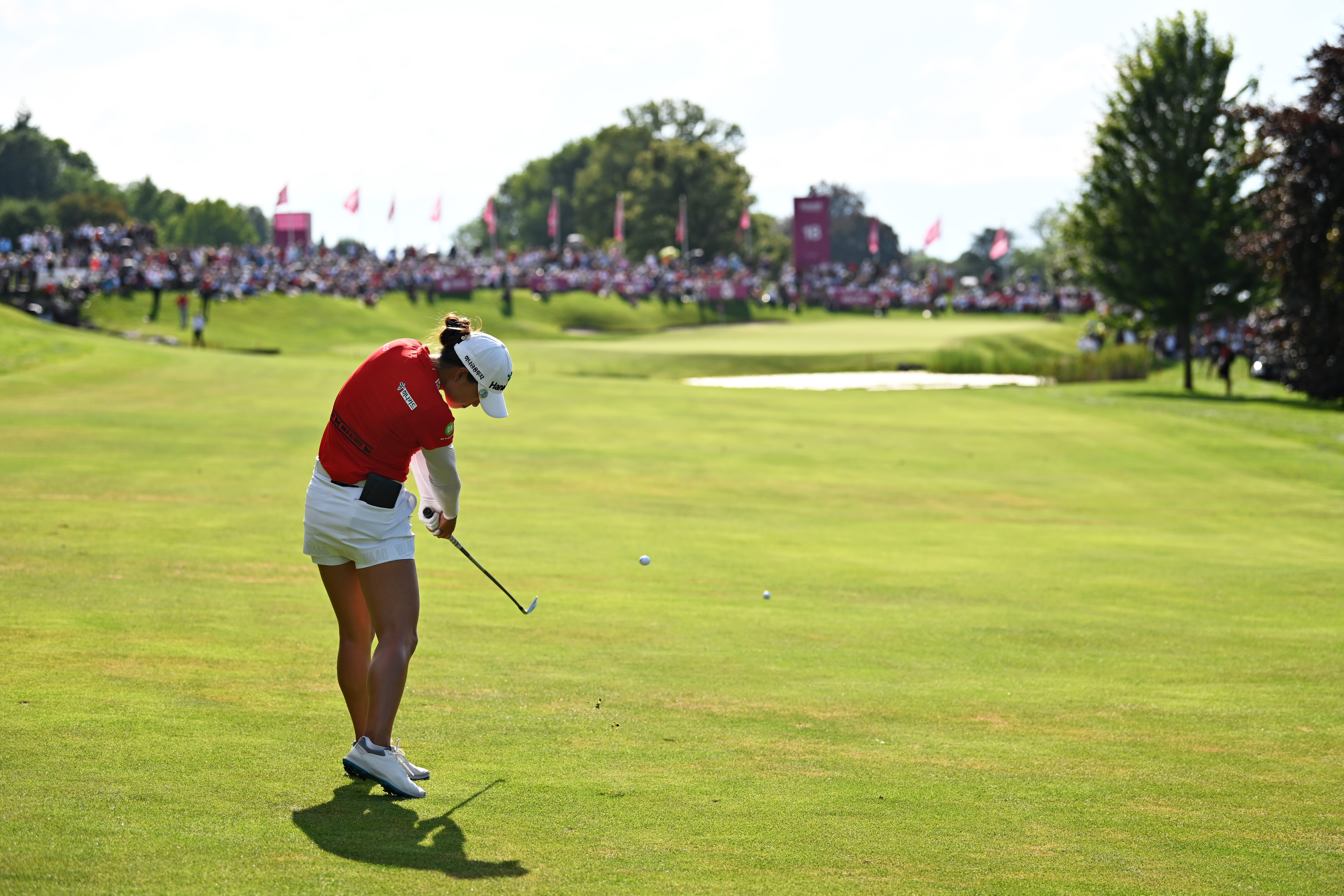 Minjee Lee plays an approach shot on the playoff hole on the eighteenth hole during day four of the The Amundi Evian Championship at Evian Resort Golf Club on July 25, 2021 in Evian-les-Bains, France. 