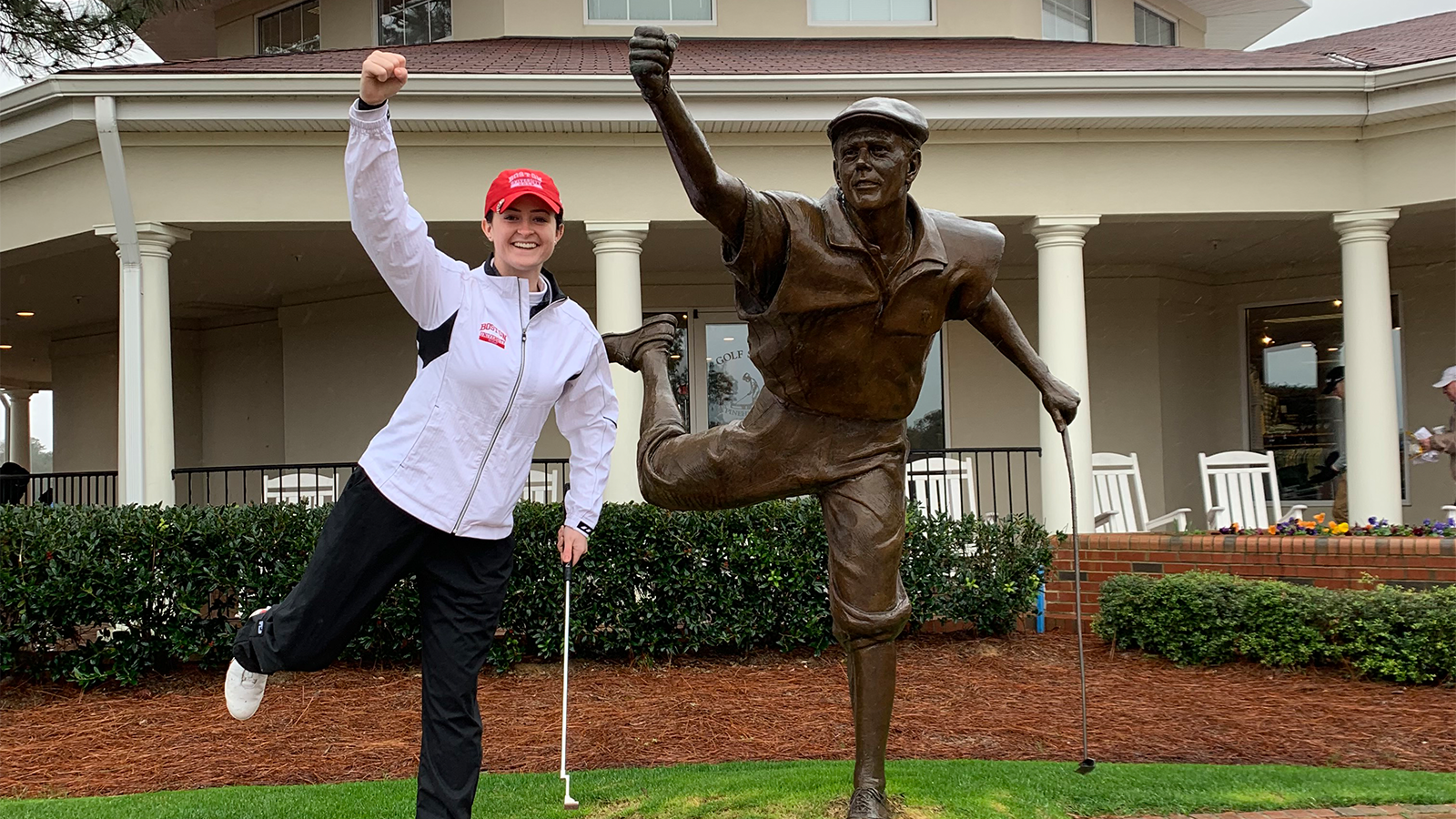 Abby Parsons, PGA, poses next to the Payne Stewart Statue at Pinehurst Resort. 