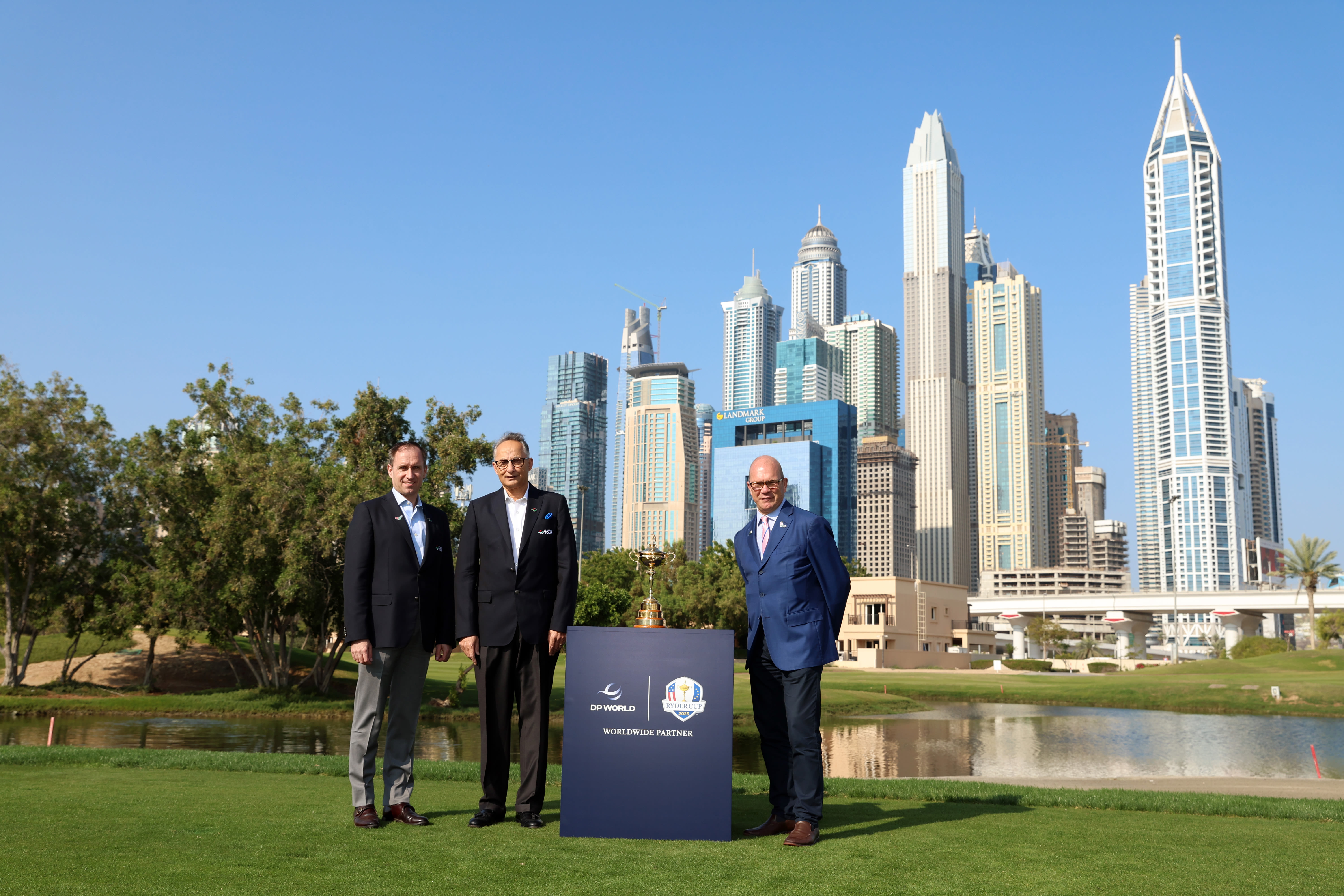 From left to right: Danny van Otterdijk, Group CCO of DP World, Yuvraj Narayan, Group Deputy CEO & CFO of DP World, join Guy Kinnings, Deputy CEO & Ryder Cup Director with the Ryder Cup in Dubai. 