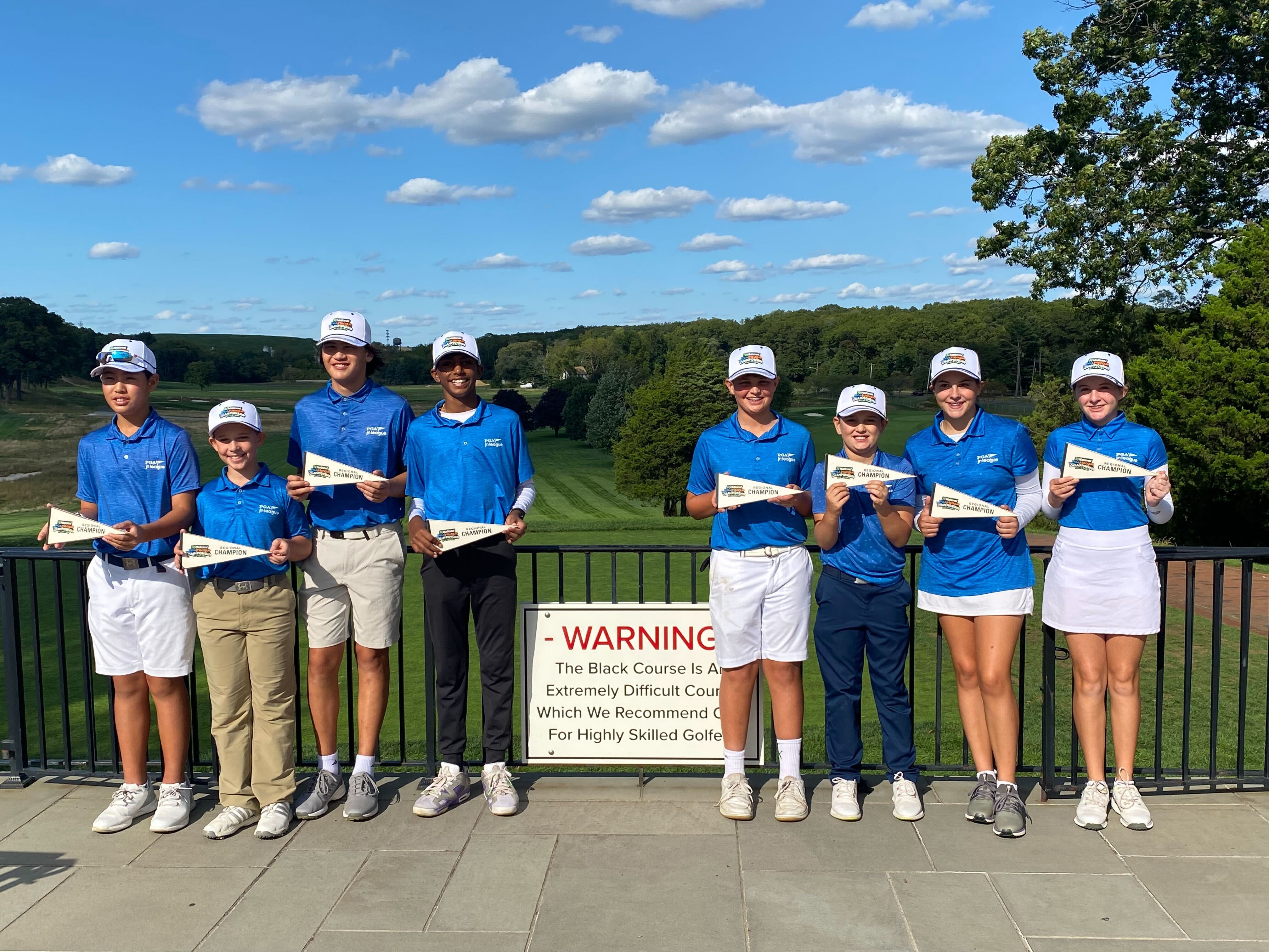 The Fairview Farm All-Stars at the iconic Bethpage Black sign.