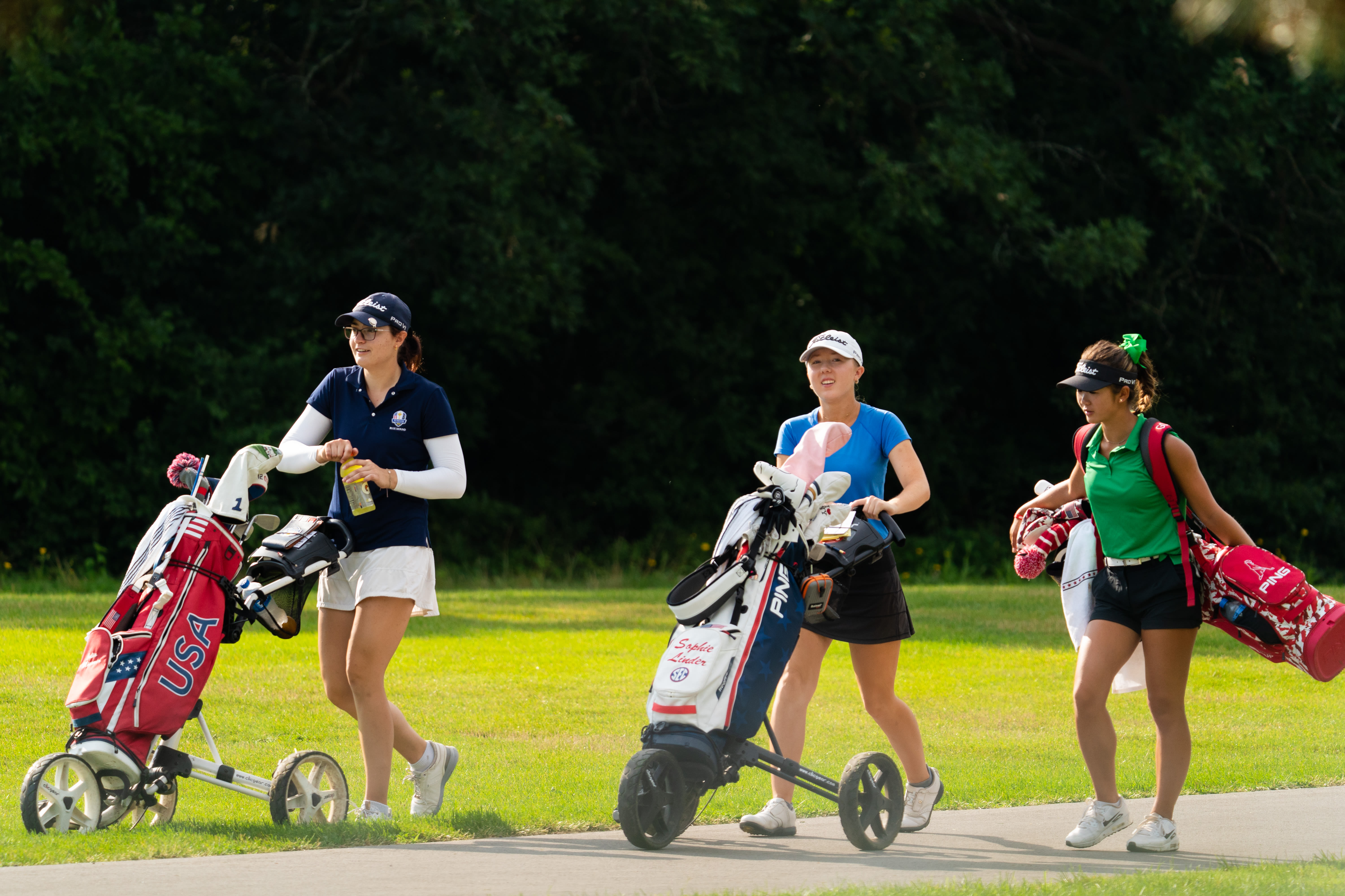 Julia Misemer, Sophie Linder and Leigh Chien walk toward the third fairway during the first round for the 46th Boys and Girls Junior PGA Championship held at Cog Hill Golf & Country Club on August 2, 2022 in Lemont, Illinois.