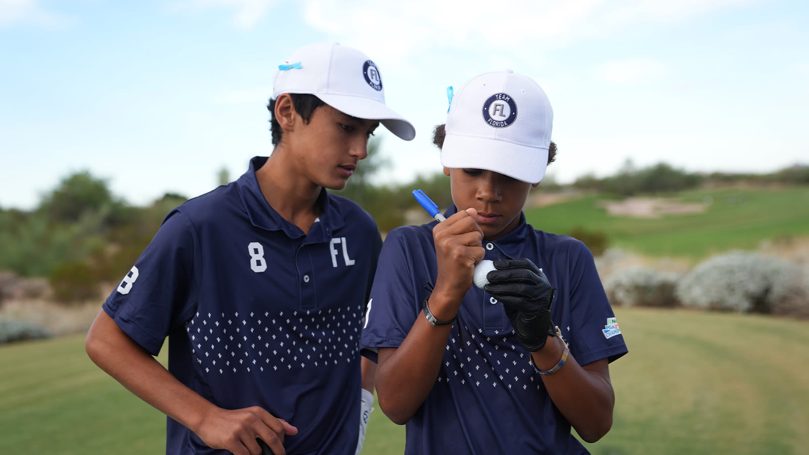 Axel Monssoh of Team Florida marks a ball during the first round of the 2022 National Car Rental PGA Jr. League Championship at Grayhawk Golf Club on October 7, 2022 in Scottsdale, Arizona. (Photo by Darren Carroll/PGA of America)