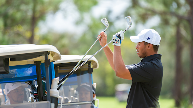 Travis Wells grabs his golf clubs on the third hole during the final round of the APGA Tour held at the PGA Golf Club on February 21, 2021 in Port St. Lucie, Florida. (Photo by Hailey Garrett/PGA of America)