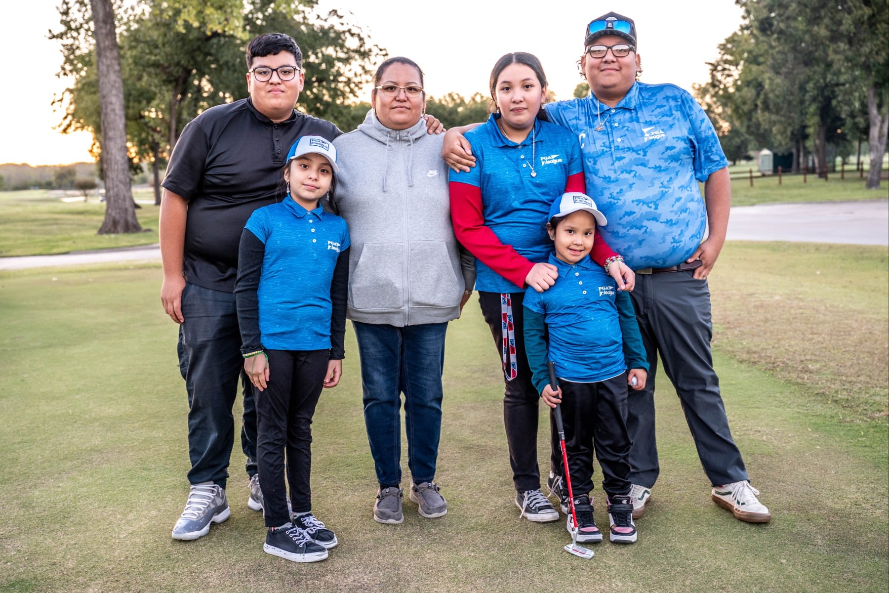 Eric (far left) and Jose (far right) Rodriguez, who now both work at Keeton Park, with their family. (Ryan Lochhead)