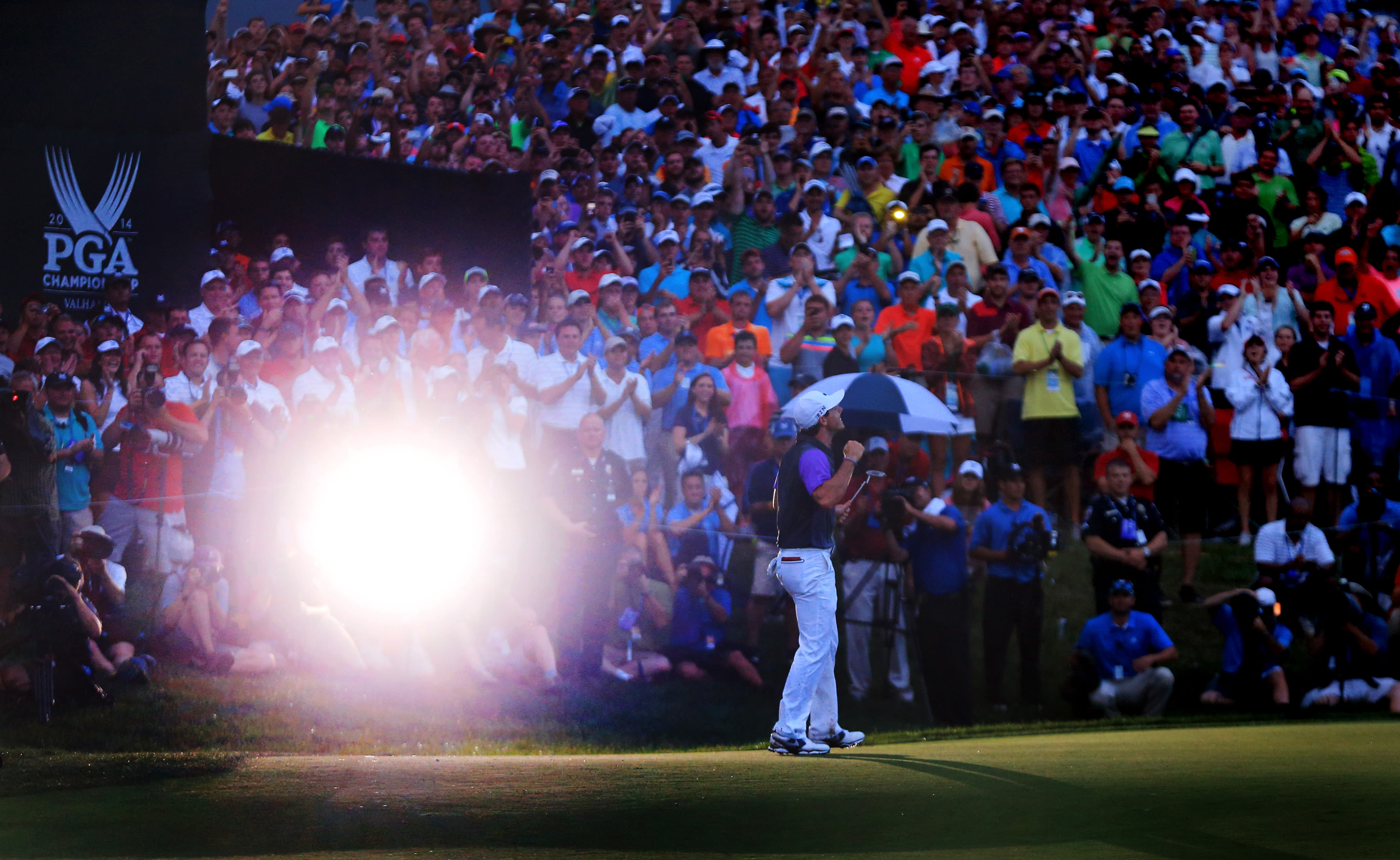 McIlroy on the 18th green after sinking the winning putt.