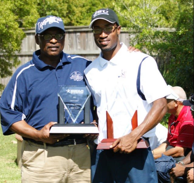 Myers with his dad after winning the SWAC title at Jackson State.