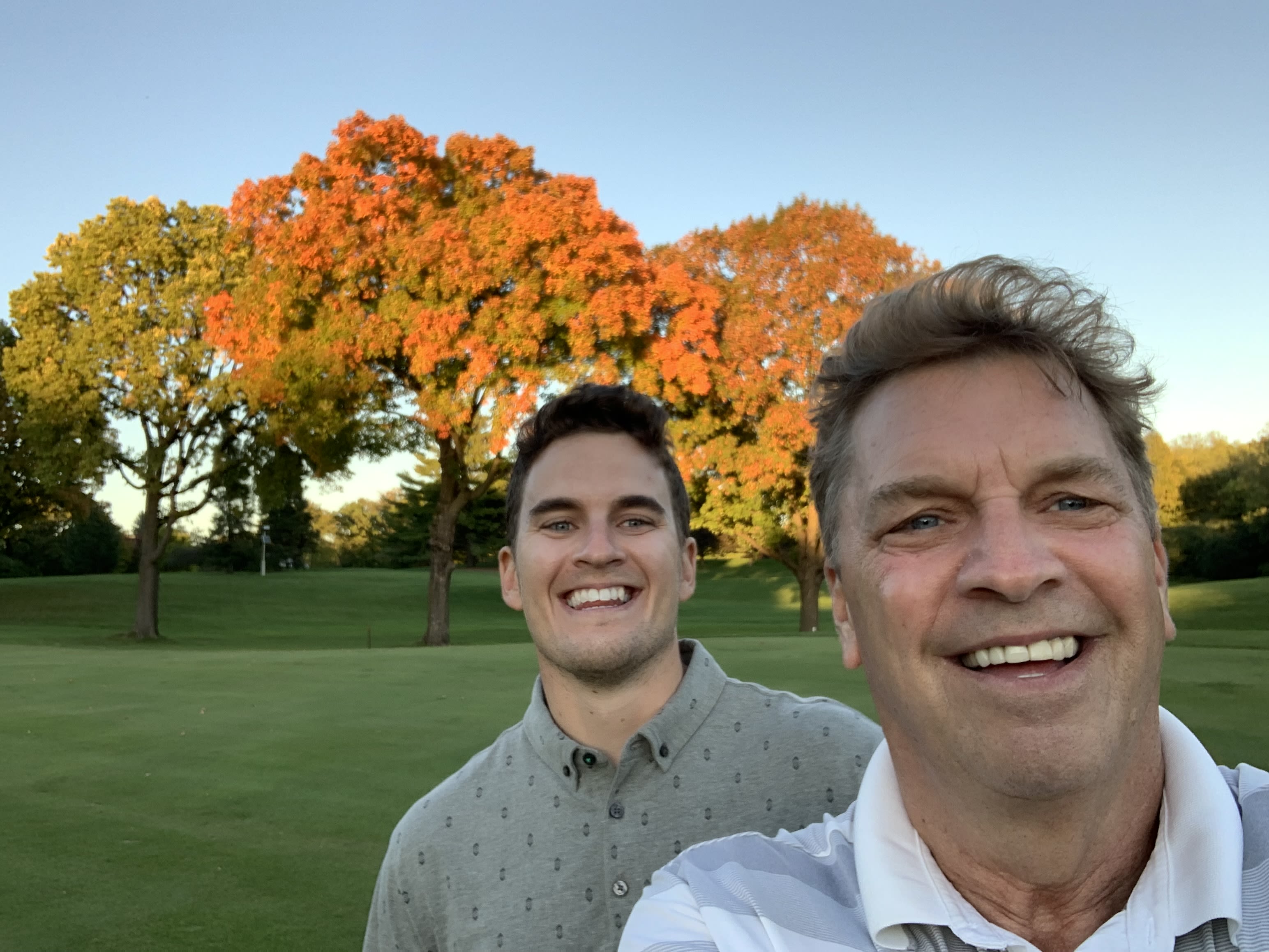 My dad and I playing golf together.