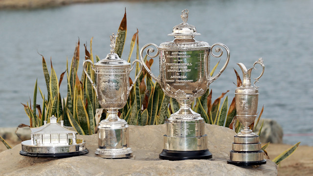 The four trophies of the men's golf Major Championships.