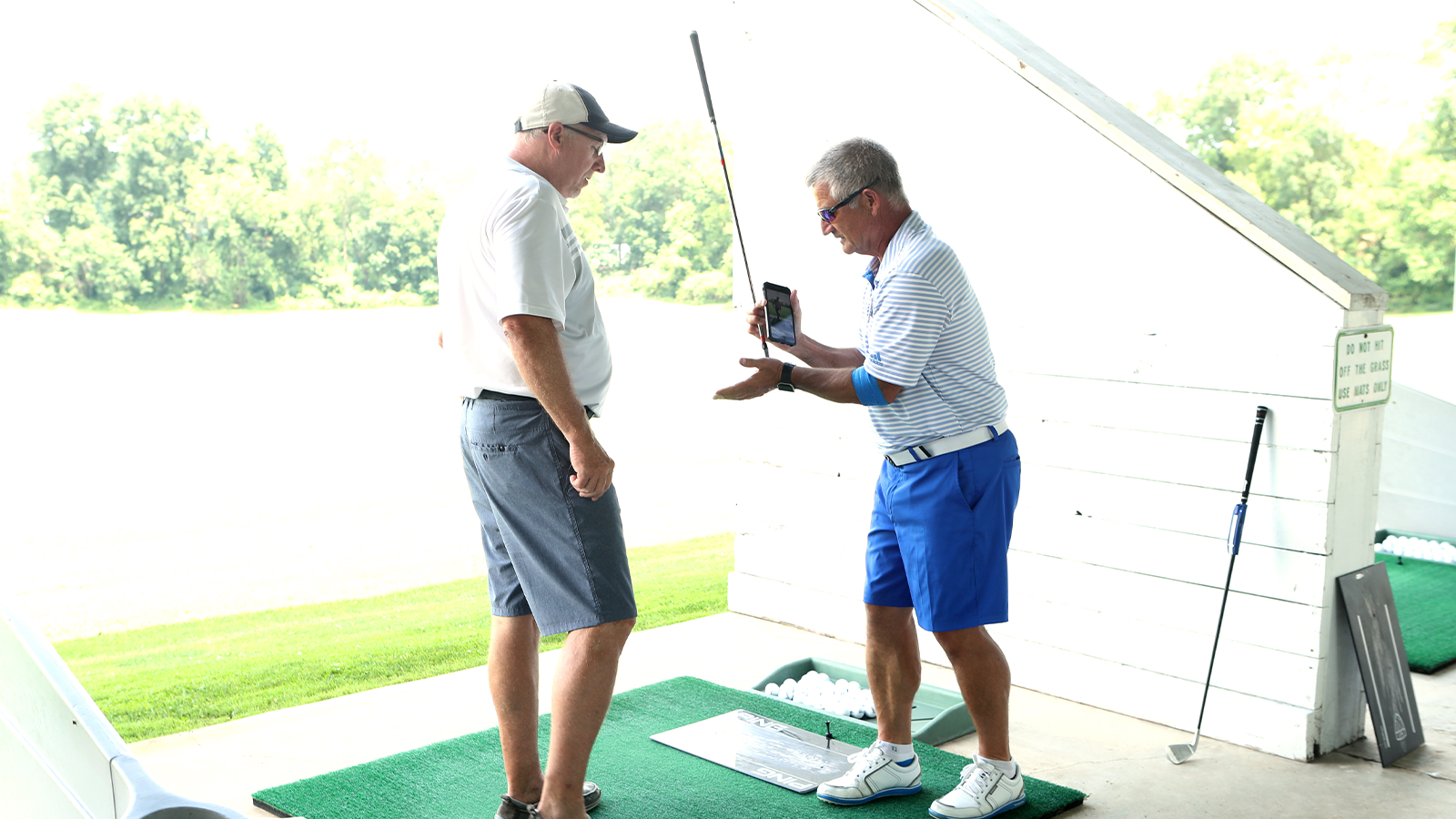 Discussing the various club elements during a fitting at Sittler Golf. 