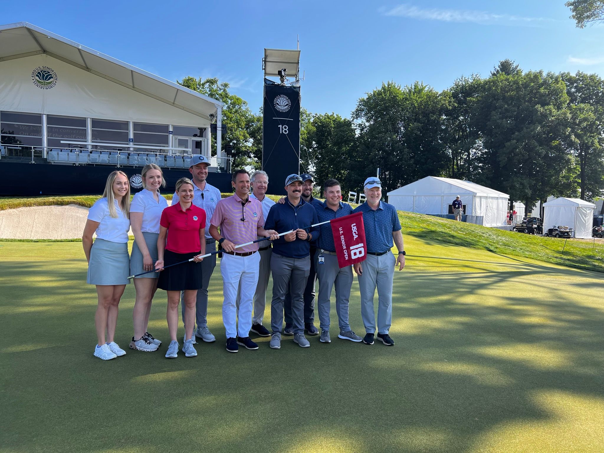 Rainbow and the SentryWorld team after the 2023 U.S. Senior Open.