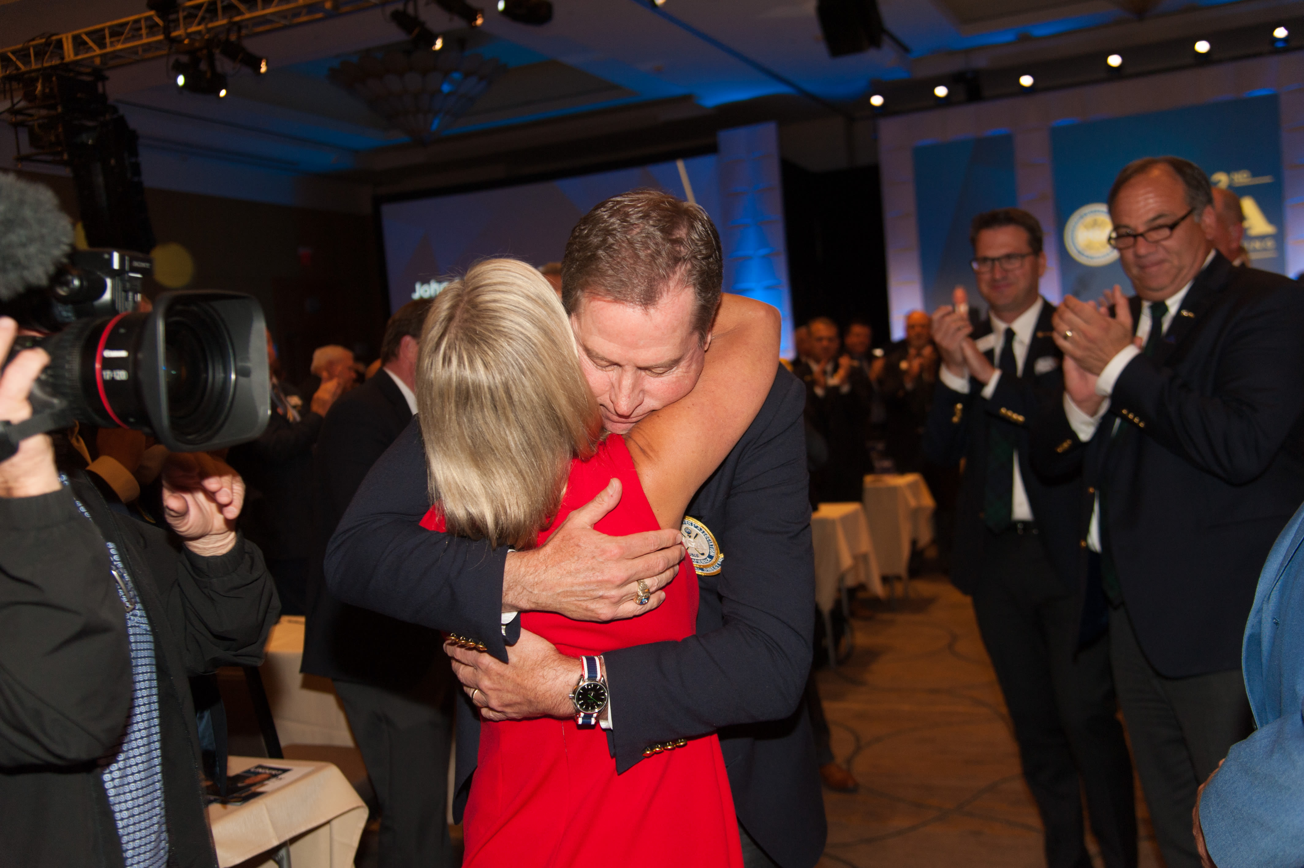 Lindert hugging his wife, Wendy, after being elected PGA Secretary.