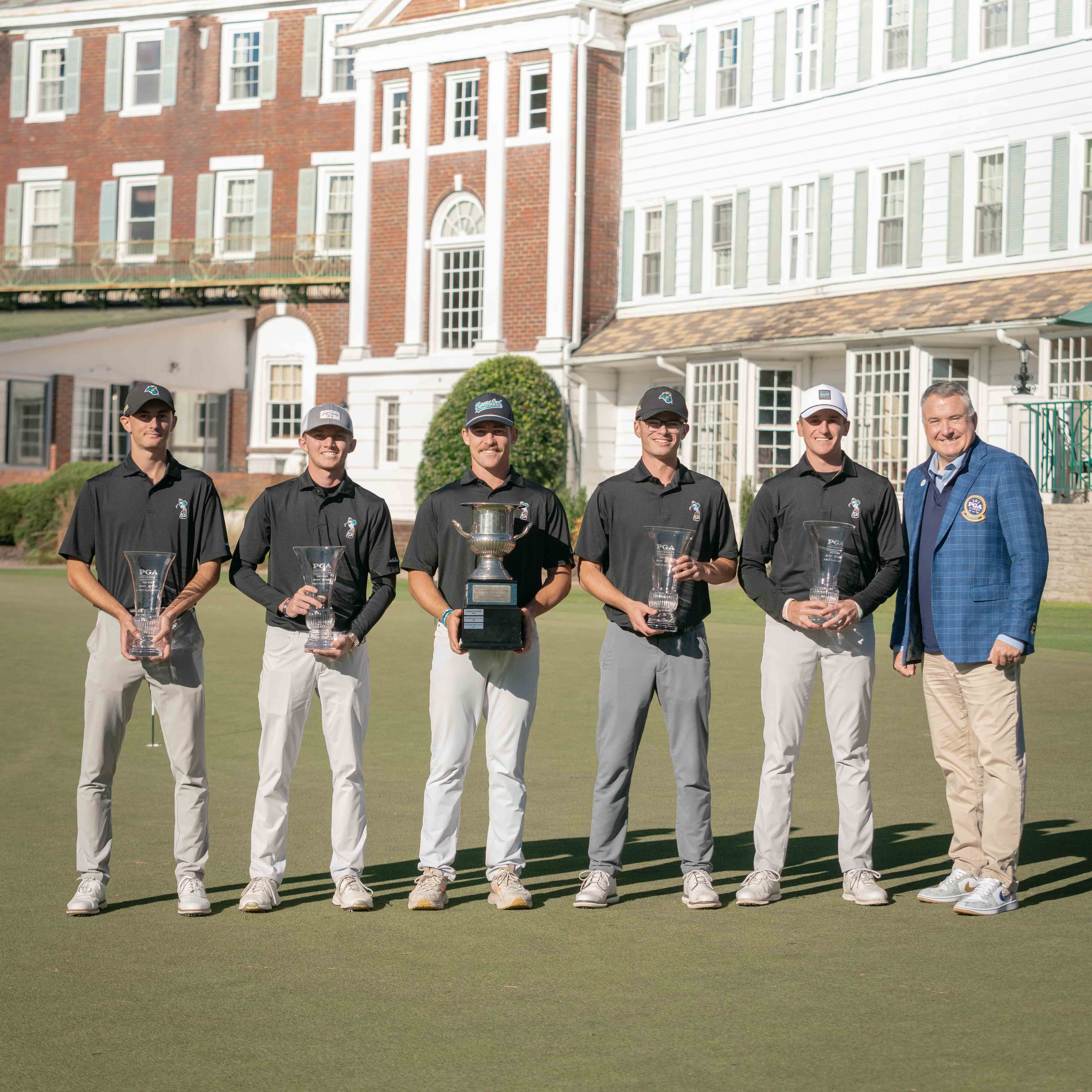 The winning Coastal Carolina squad with PGA President Don Rea Jr.