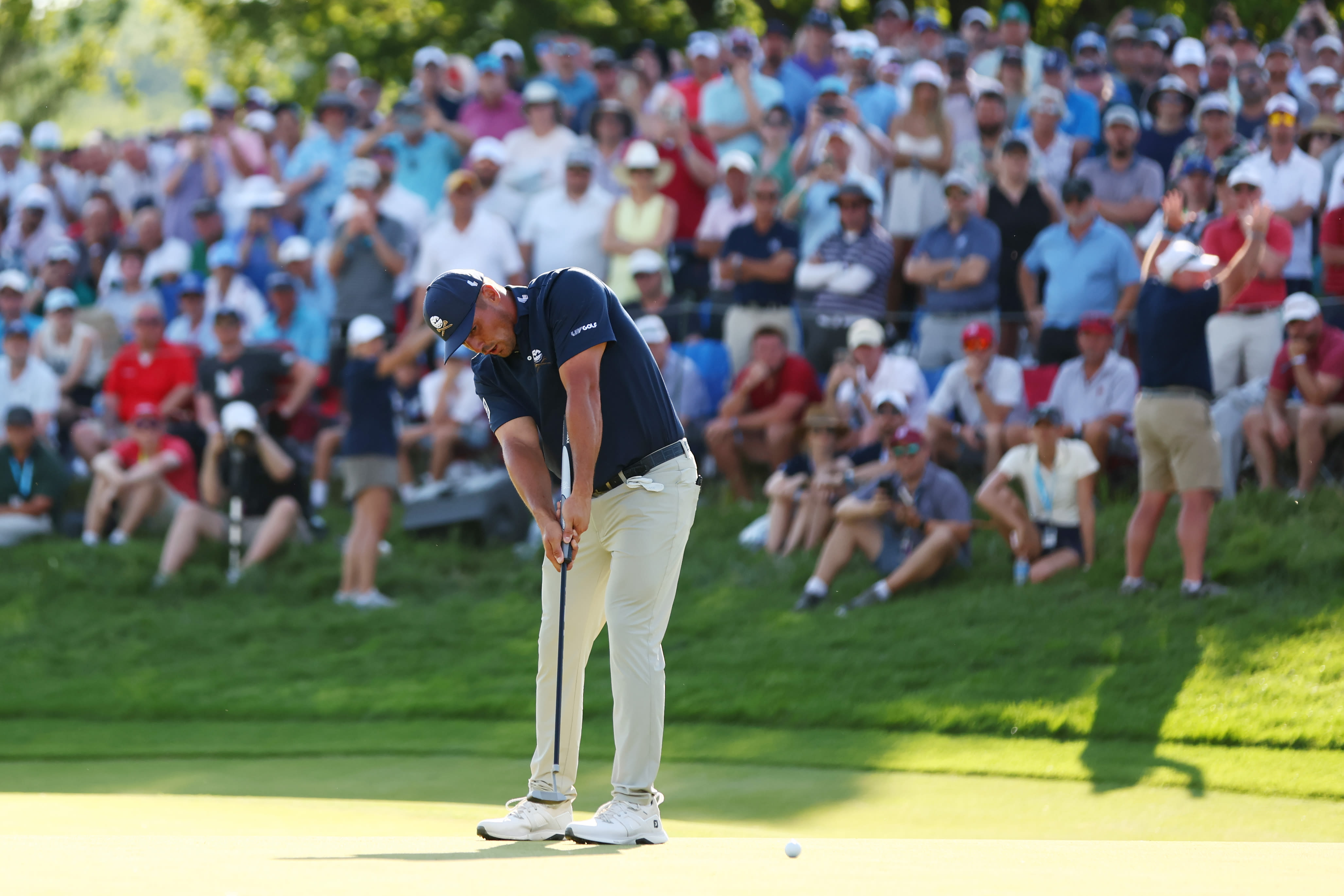 Bryson DeChambeau employs the arm-lock grip.