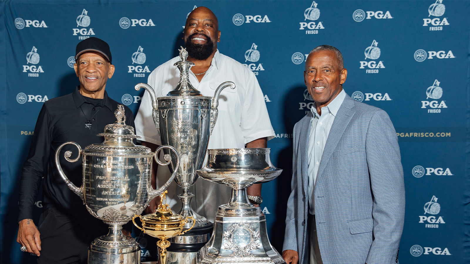 Former Dallas Cowboy Players, Drew Pearson, Ed “Too Tall” Jones & Tony Dorsett pose with the trophies during the Welcome Home Celebration at PGA Frisco Campus on August 22, 2022 in Frisco, Texas. (Photo by Daryl Johnson/PGA of America)