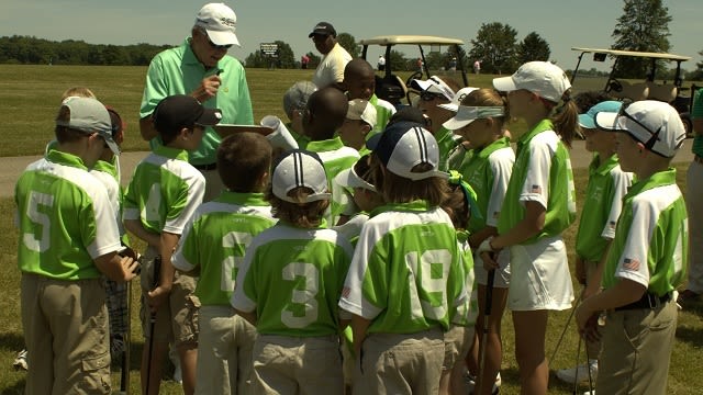 Junior golf team and coach