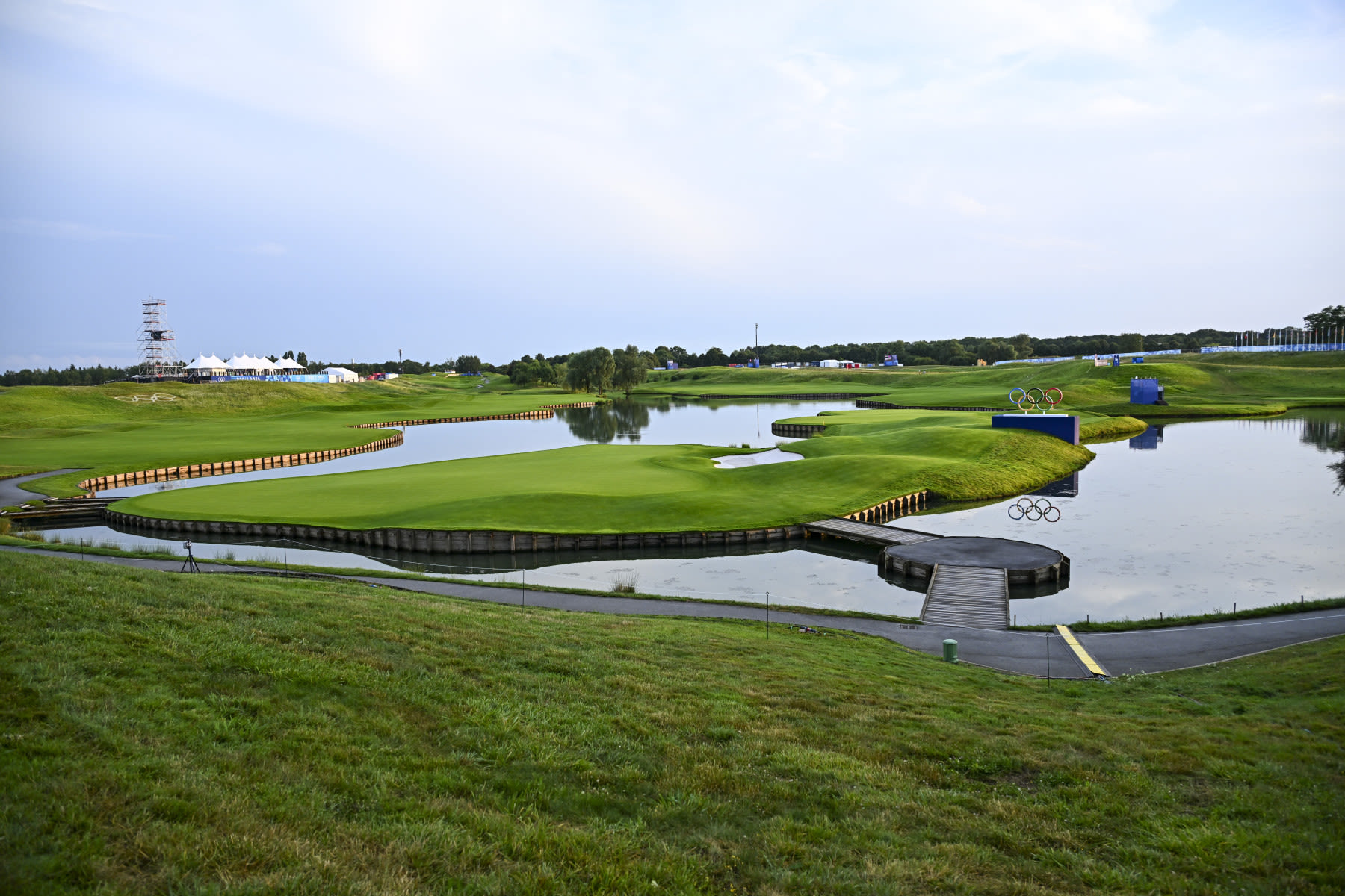 Water creeps in on the fairway and surrounds the green on No. 18.