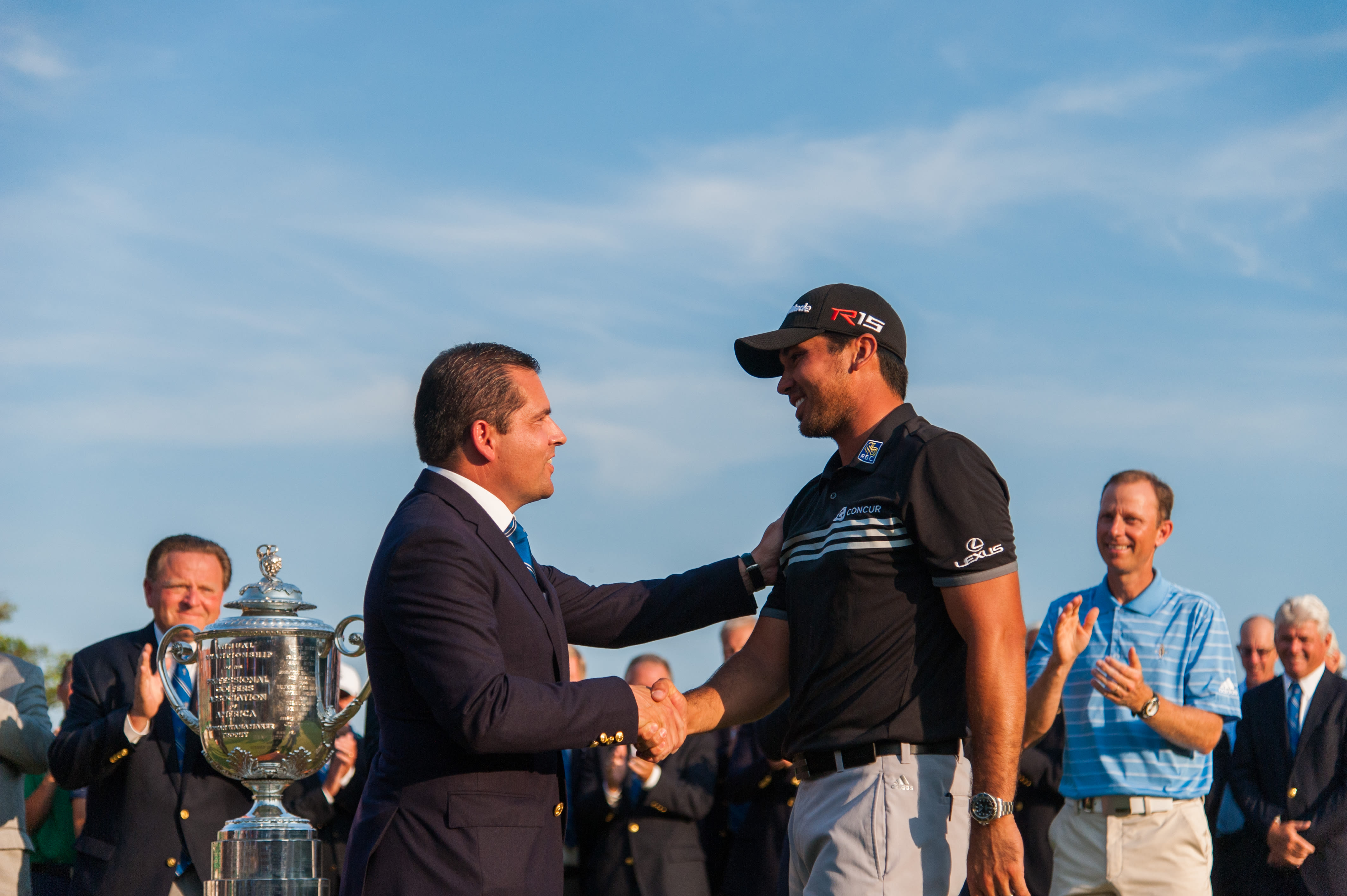 Sprague shakes hands with 2015 PGA Champion Jason Day, who would go on to win The Players the following spring at TPC Sawgrass.