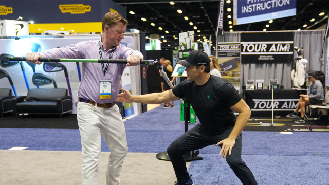 An attendee tries equipment from GolfForever during the 2023 PGA Show at Orange County Convention Center on Thursday, January 26, 2023 in Orlando, Florida. (Photo by Scott Halleran/PGA of America)