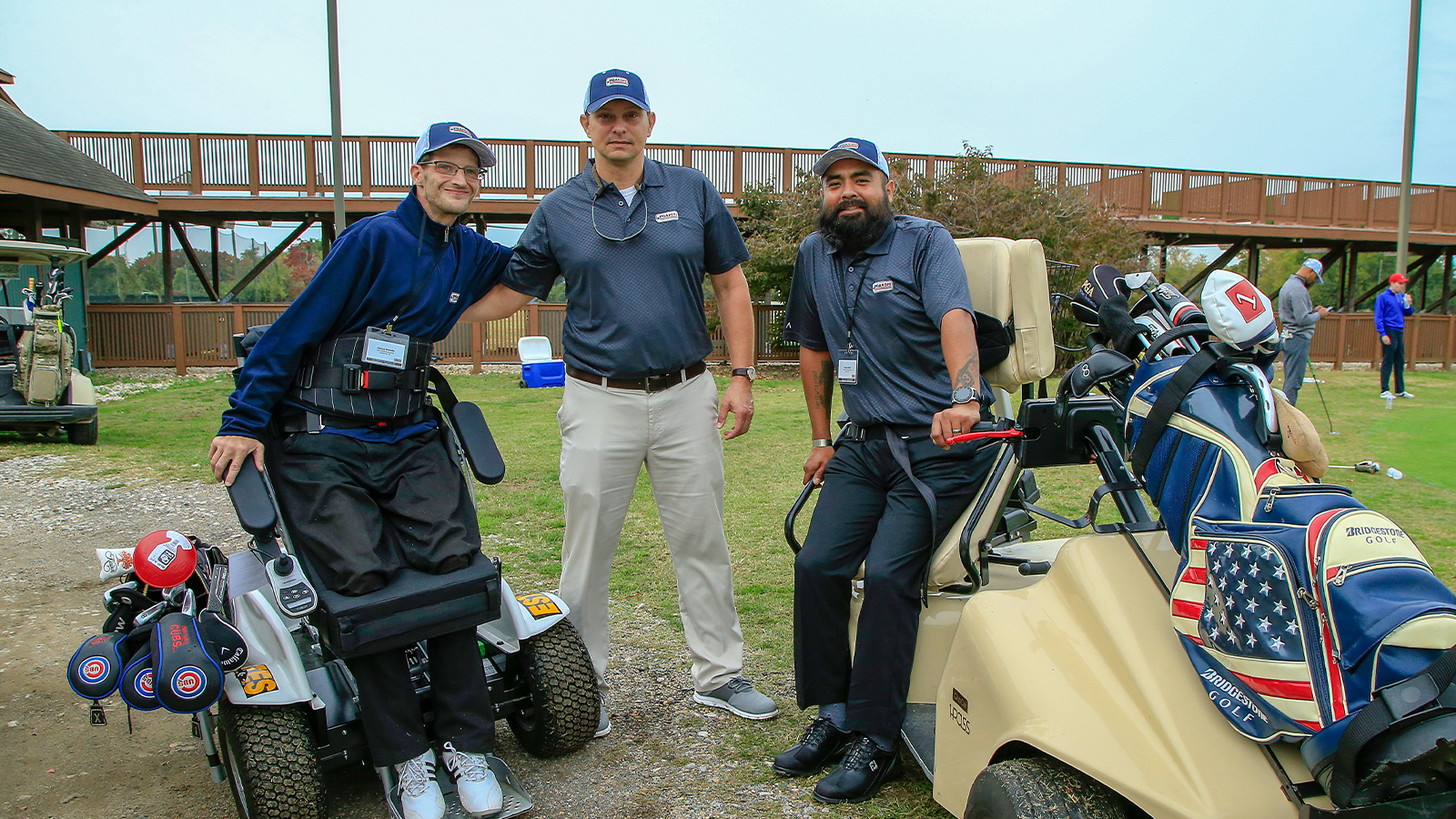 Matt Underwood (center) with fellow Veterans during the Golf Training event for PGA HOPE National Golf & Wellness Week at East Potomac Golf Course, Washington, DC on October 26, 2019