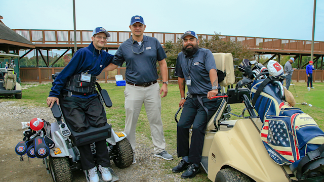 Matt Underwood (center) with fellow Veterans during the Golf Training event for PGA HOPE National Golf & Wellness Week at East Potomac Golf Course, Washington, DC on October 26, 2019