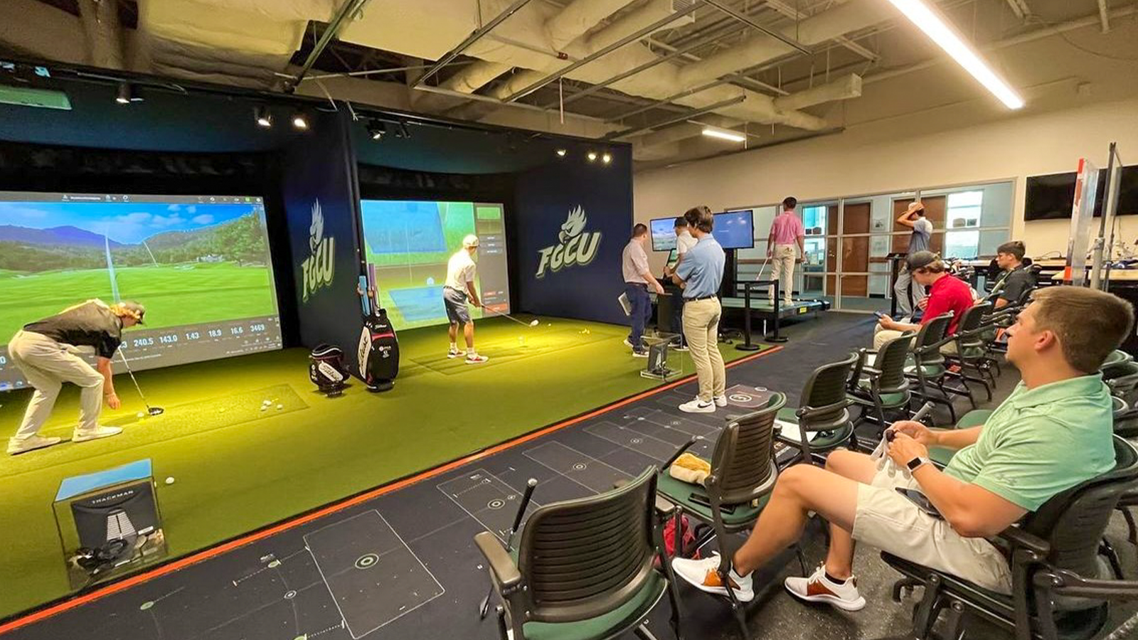 Students spending time in the newly renovated FGCU PGM Swing Lab.