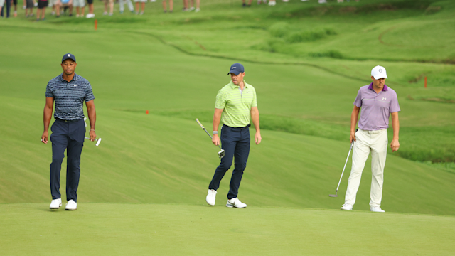 Tiger Woods, Rory McIlroy and Jordan Spieth study the 10th green during the first round of the 2022 PGA Championship.(Photo by Andrew Redington/Getty Images)
