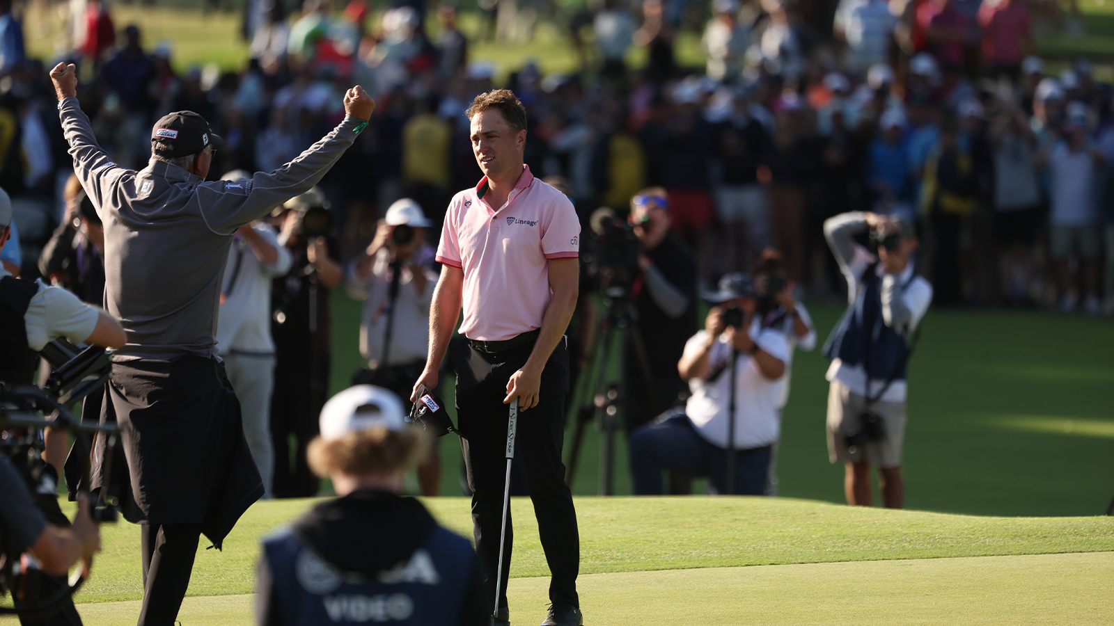 Justin Thomas & PGA Professional, Mike Thomas react to winning on the 18th green during a playoff for final round of the 2022 PGA Championship held at Southern Hills Country Club on May 22, 2022 in Tulsa, Oklahoma. (Photo by Maddie Meyer/PGA of America)