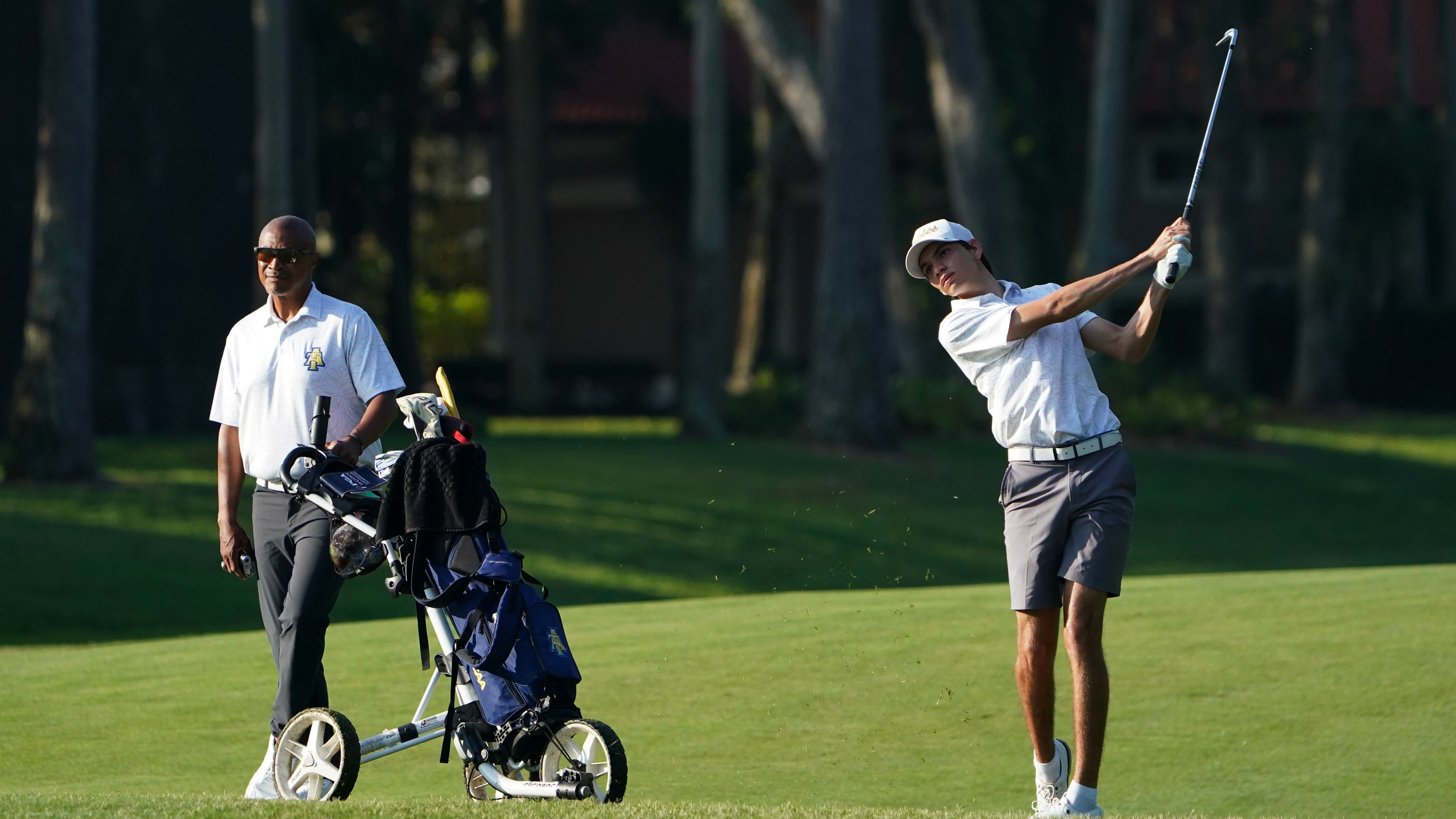 Camilo Marin Raga of North Carolina A&T State University standing with Head Coach Scooter Clark during the 2024 PGA WORKS Collegiate Championship