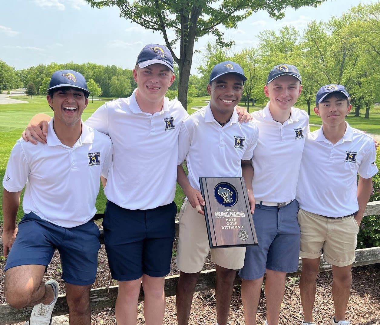 Joseph Fenceroy (middle) with his high school golf teammates in Wisconsin.