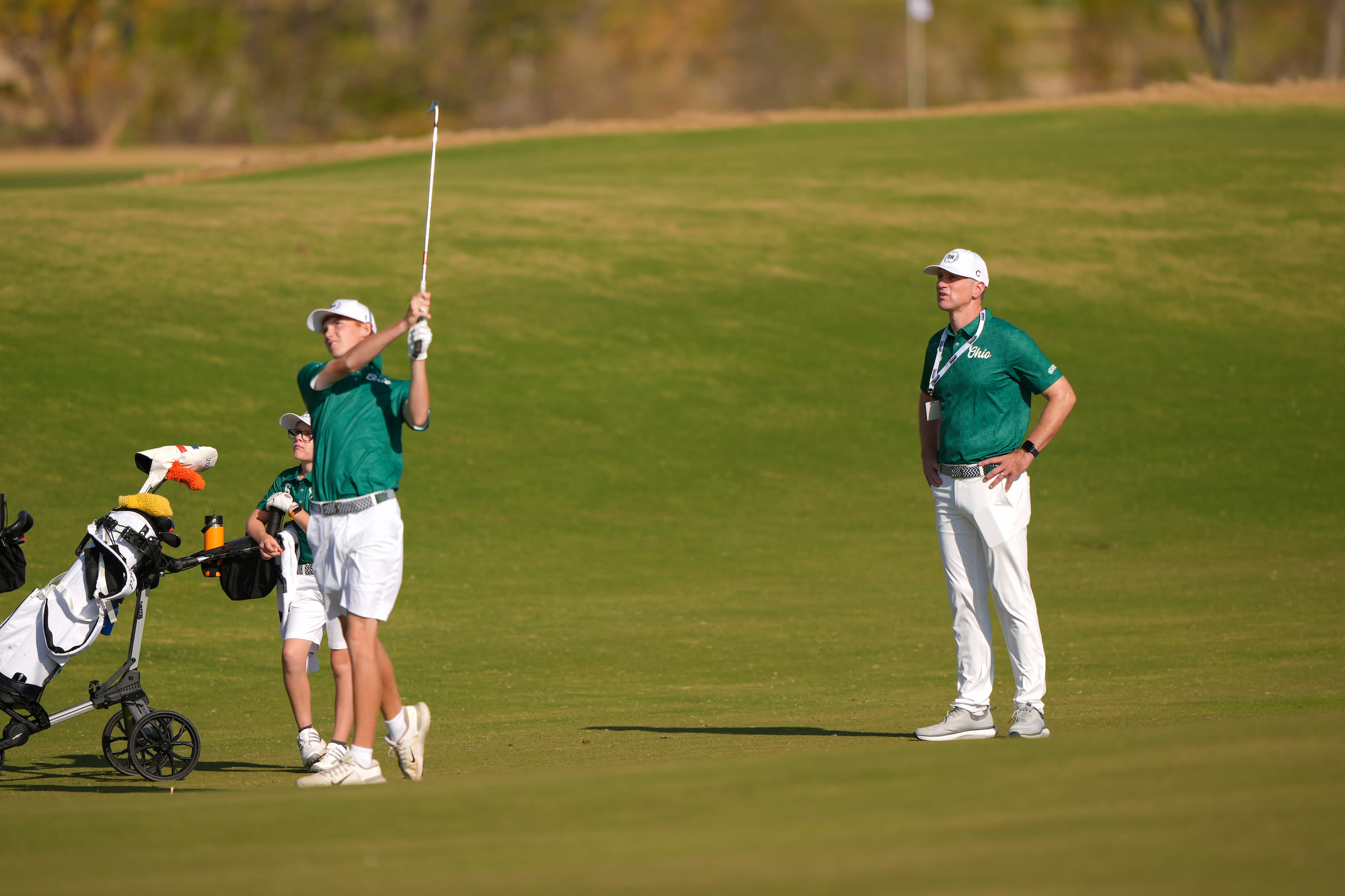 Yoder watches one his players during a Championship practice round.