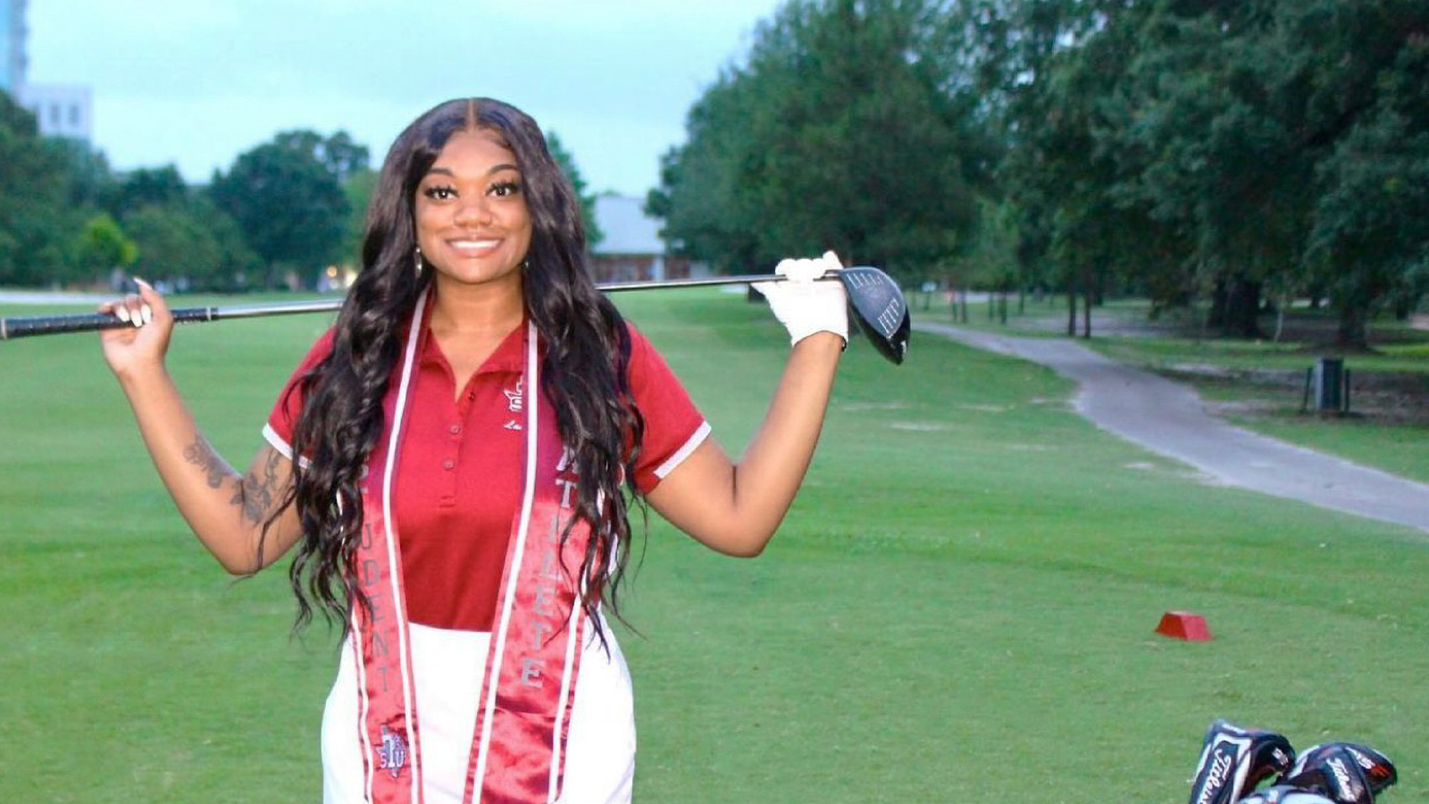 Paul Millsap PGA WORKS fellow Destany Hall poses on the golf course. 