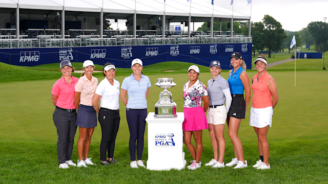 Corebridge Financial team members Kim Paez, Allie Knight, Sandra Changkija, Joanna Coe, Nicole Felce, Allie White, Natalie Vivaldi, and Loretta Giovannettone pose with the KPMG Women's PGA Championship trophy at Hazeltine National Golf Club in Chaska, Minnesota.