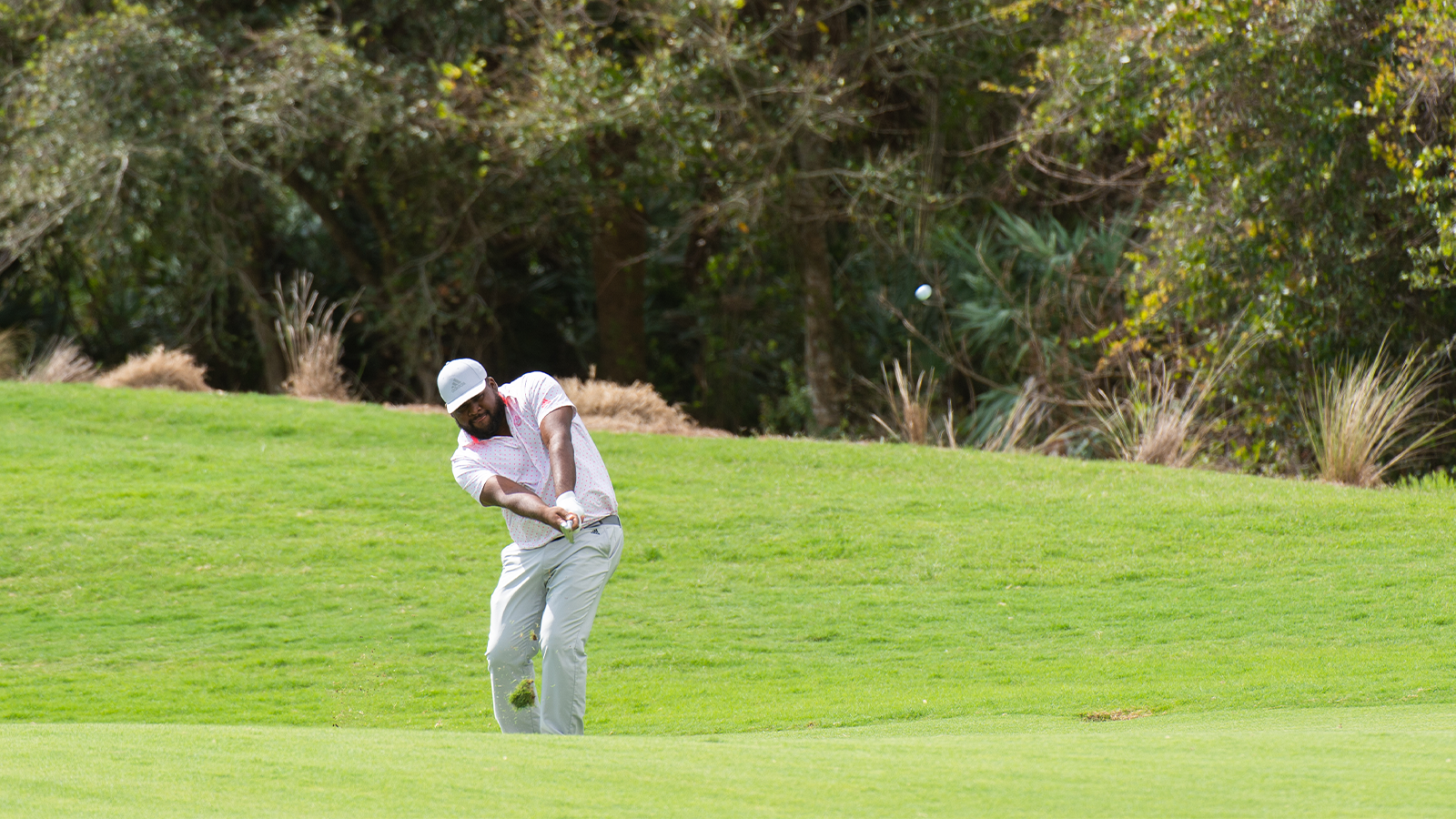 Daniel Augustus chips onto the second green during the final round of the APGA Tour 