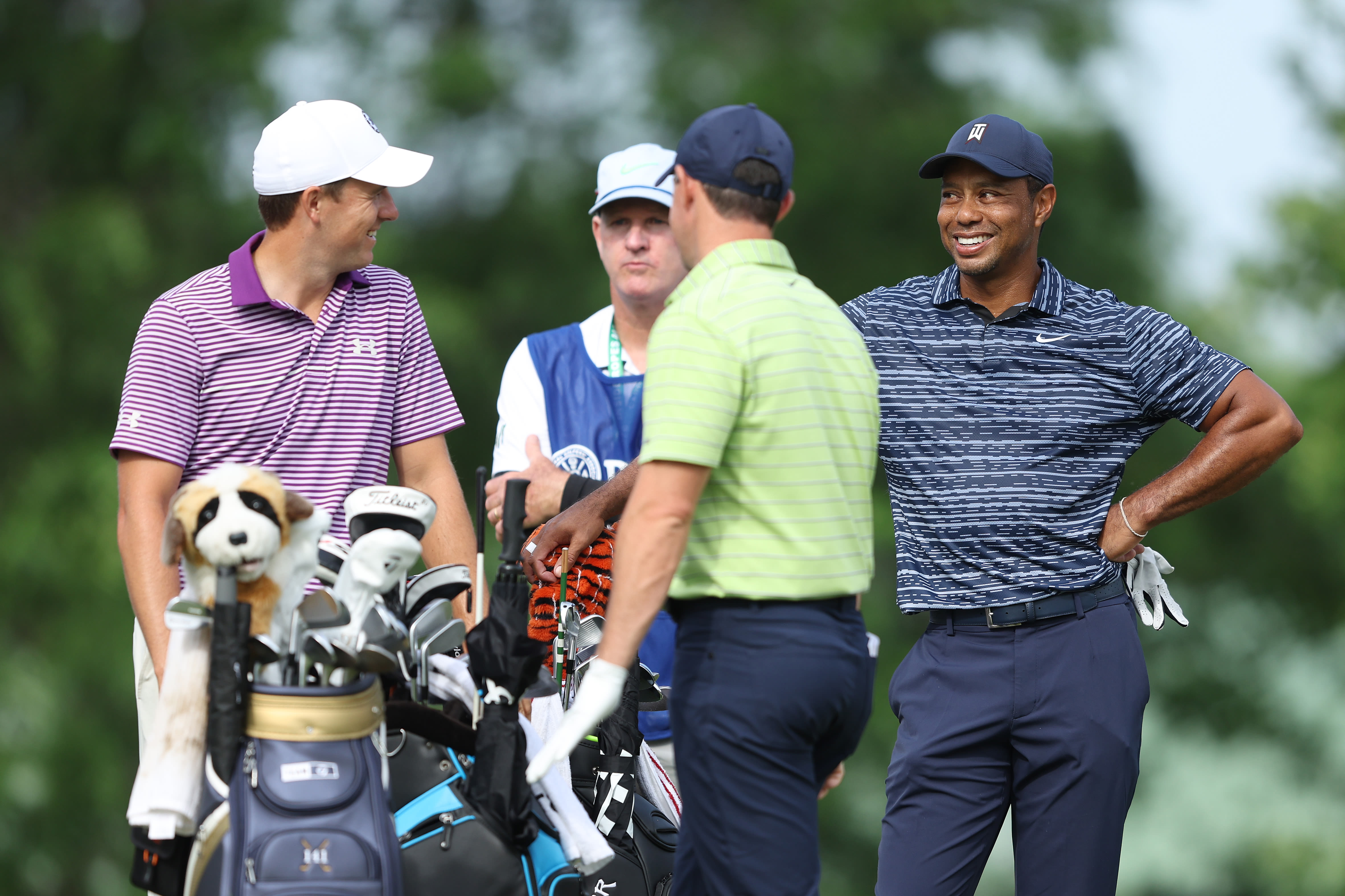 Tiger Woods, Rory McIlroy, and Jordan Spieth, prepare to tee off on the 14th tee during the first round of the 2022 PGA Championship at Southern Hills Country Club on May 19, 2022 in Tulsa, Oklahoma.