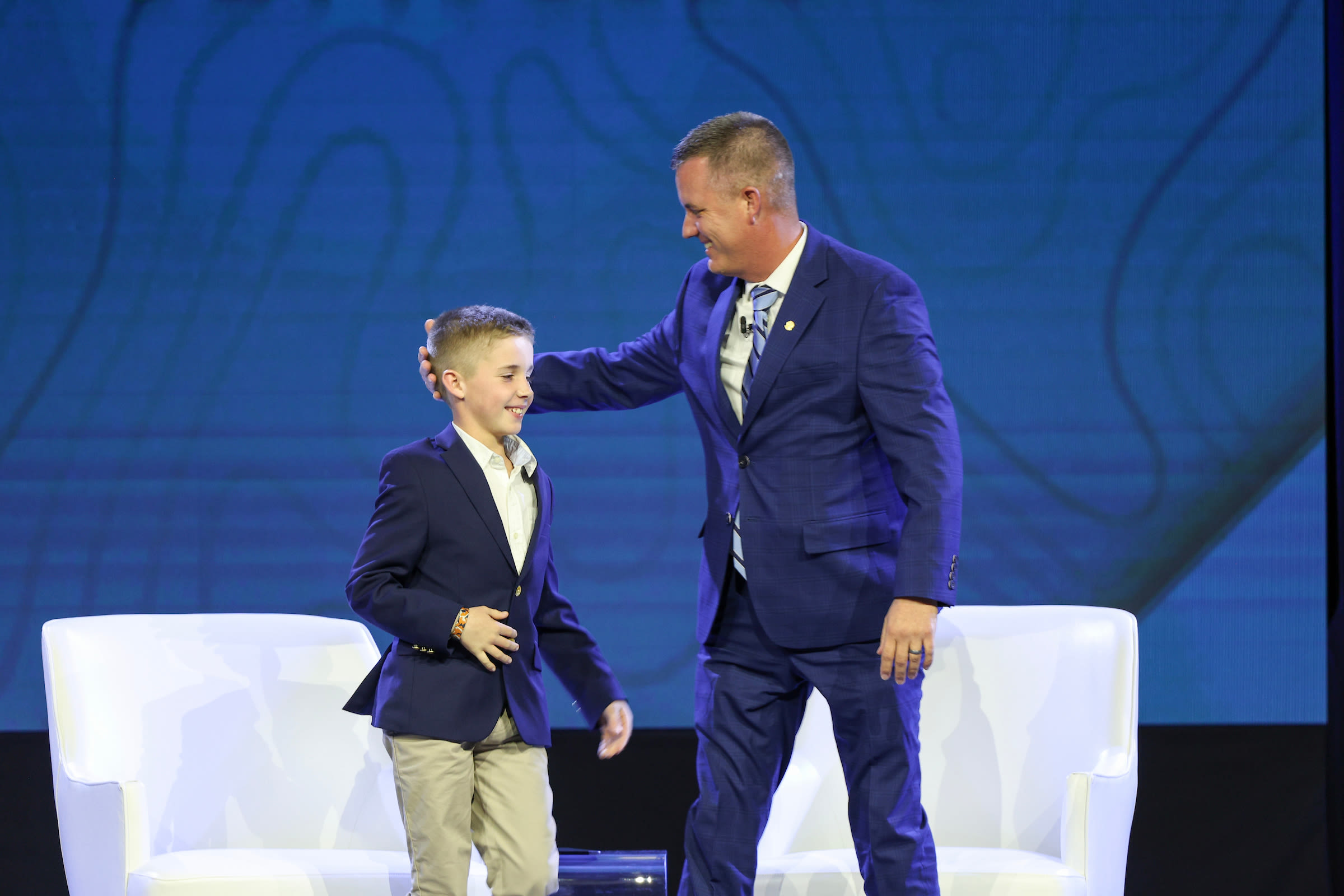 Williams and his son Cameron at the 108th PGA Annual Meeting.