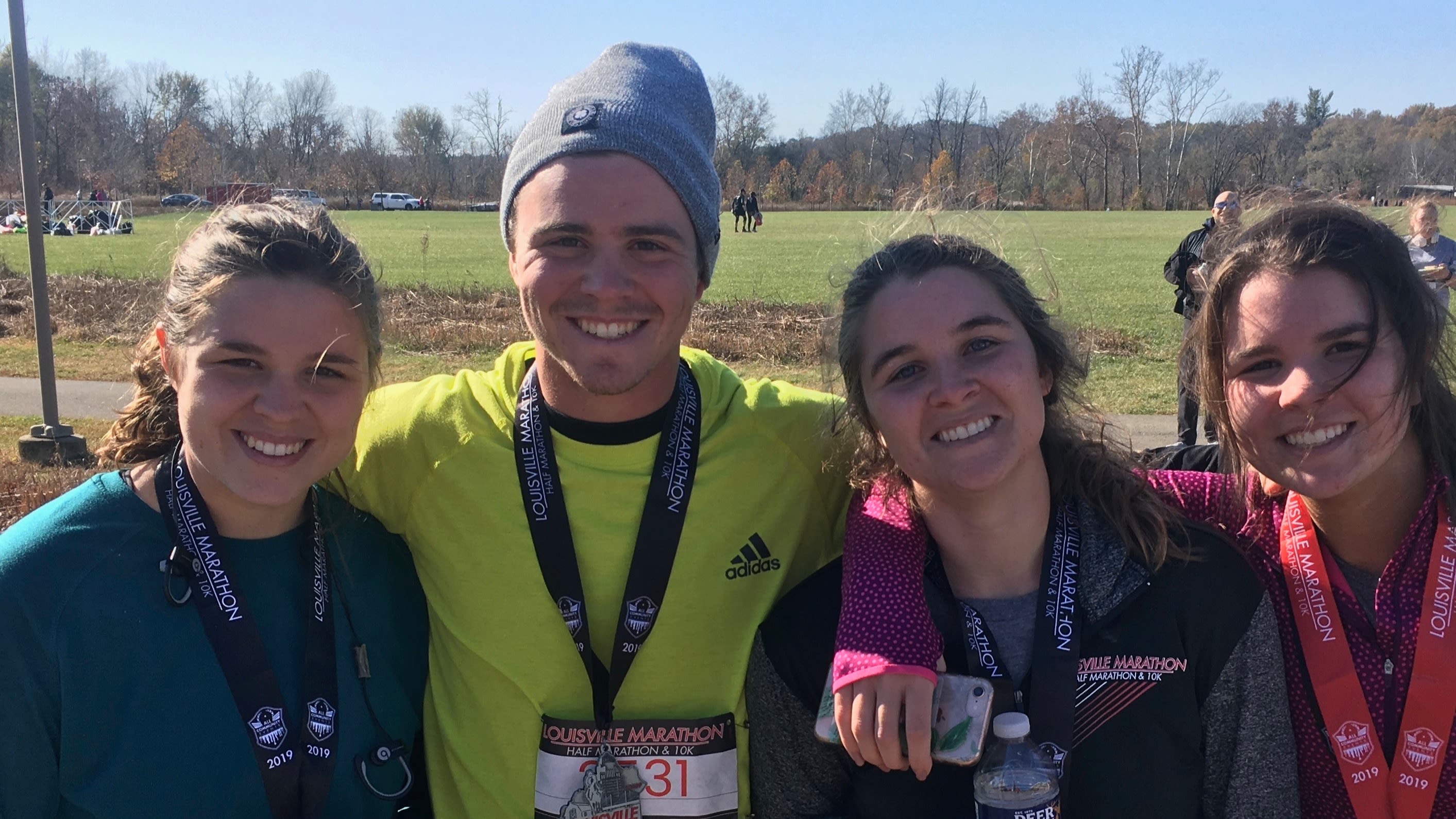 Alec Bahnick (middle) with family at the Louisville Marathon.