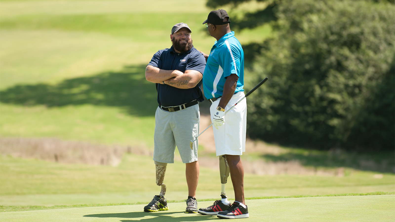 Chris Nowak with a contestant during the Secretary's Cup held at Charlotte Country Club in Charlotte, North Carolina. (Montana Pritchard/PGA of America)
